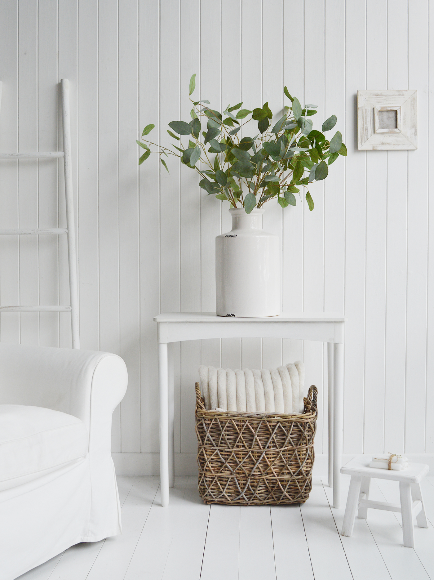 Simply white... an all white interior with a contrasting Cascao Bay grey willow baskewt and Silver Dollar Eucalyptus to add texture and interest