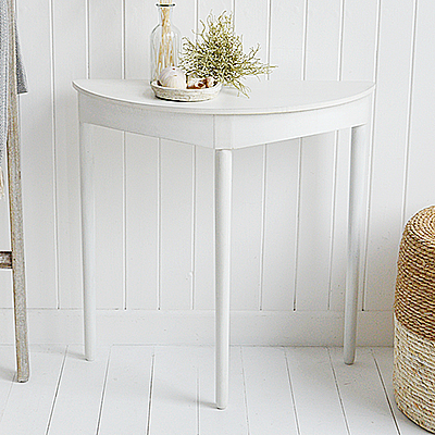 The White Lighthouse Cape Anne furniture in white. A simple white half moon console table. Cape Ann simple white table for console or dressing table for New England white furniture in coastal, modern country and farmhouse homes and interiors