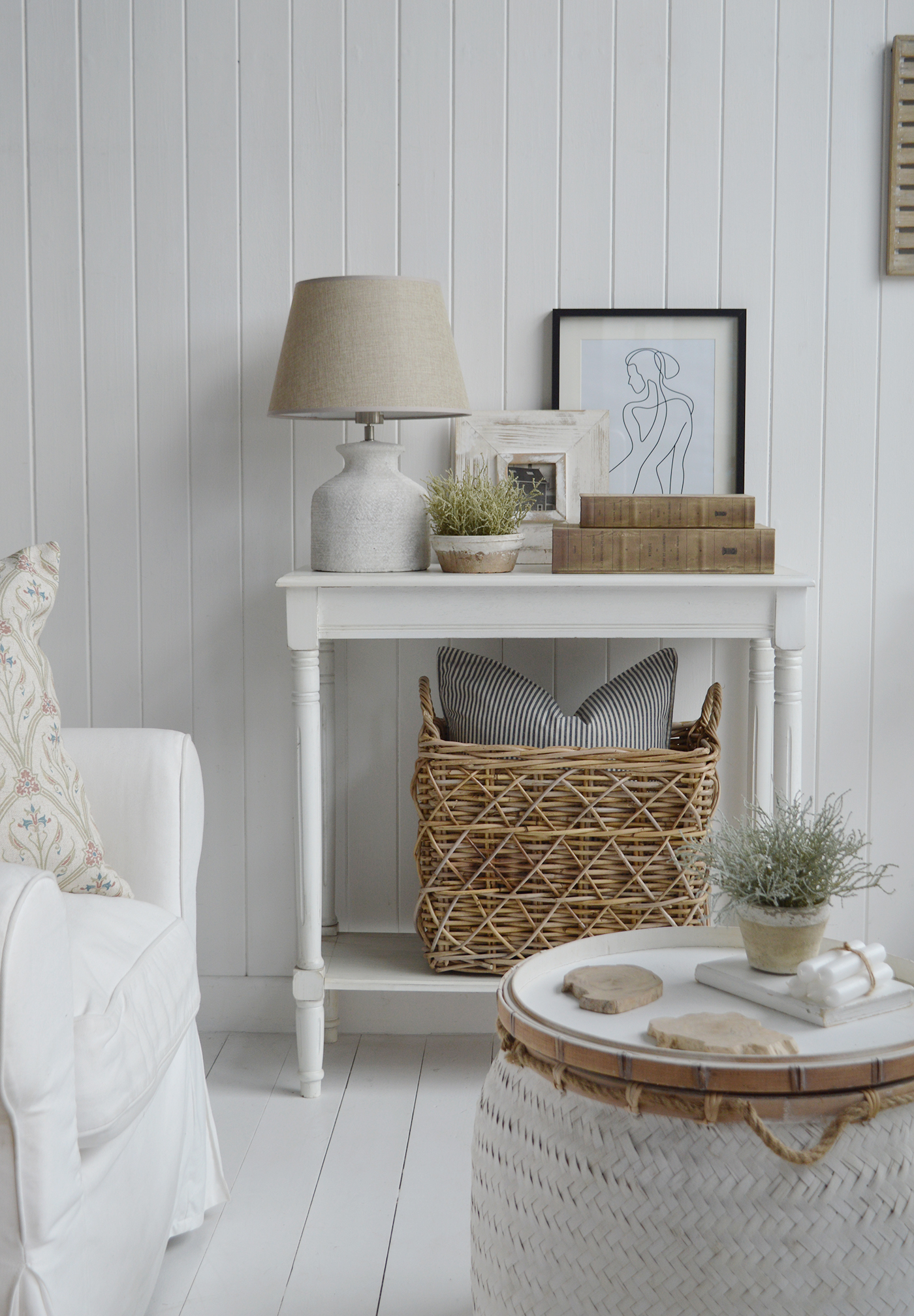 Cape Ann White beach house style coastal white console table with a shelf, shown here with the Casco Bay basket under for storage