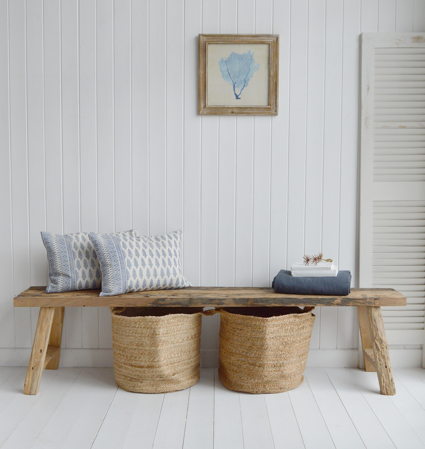 A rustic wooden bench adds timeless charm to farmhouse interiors, blending natural wood tones with vintage-inspired decor