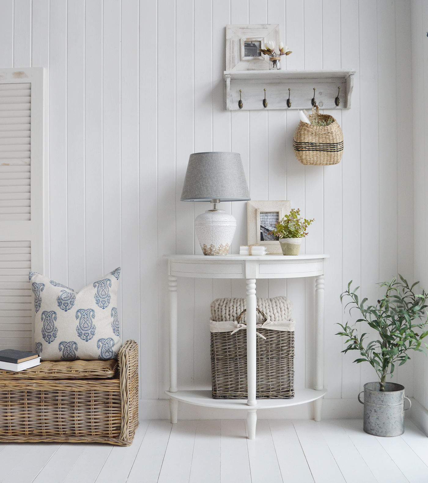 The white half moon console table, a perfect table in the haalway, as a bedside or a lamp table in the living room. Shoen here with the white ceramic Charlton lamp, constrasting Casco Bay storage bench and our faux Olive tree to add extra interest.