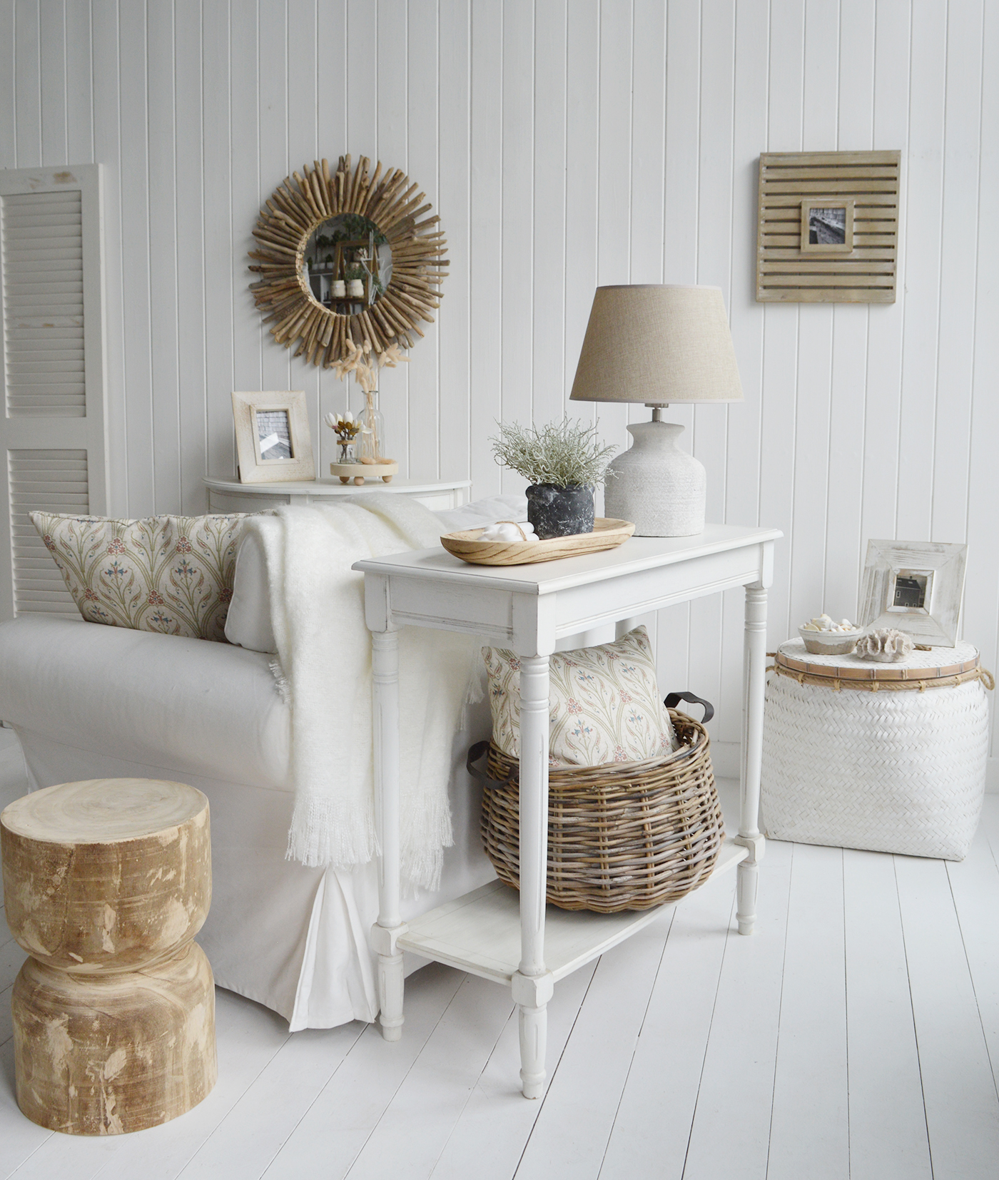The Cape Ann white console table as a sofa table in a New England styled home, add a basket to the shelf for extra storage and create different textures for coastal and beach house interiors