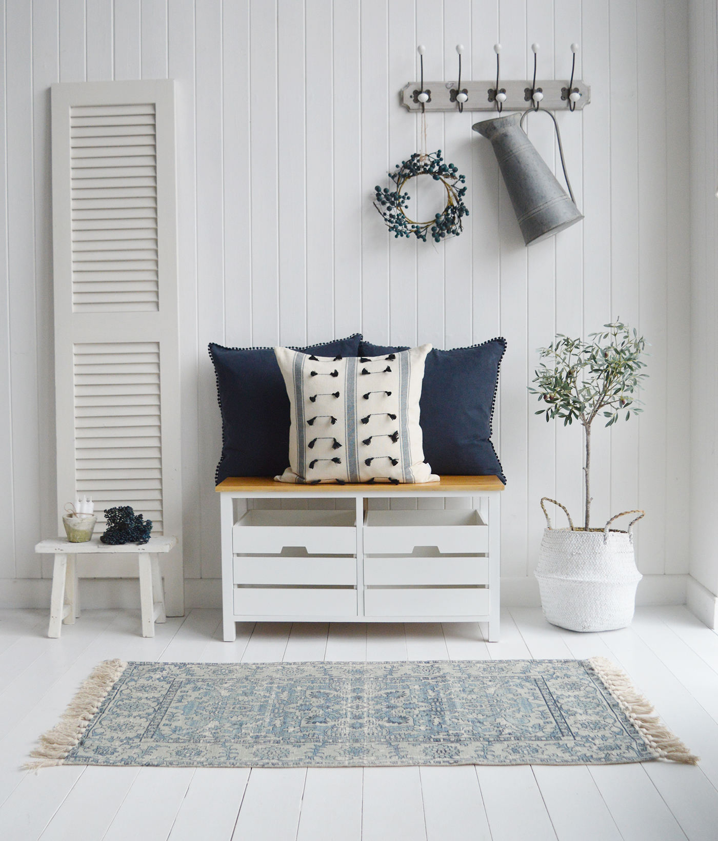 Connecticut white hallway storage bench with drawers with the Cape Cove rug and linen cushions for a classic New England look