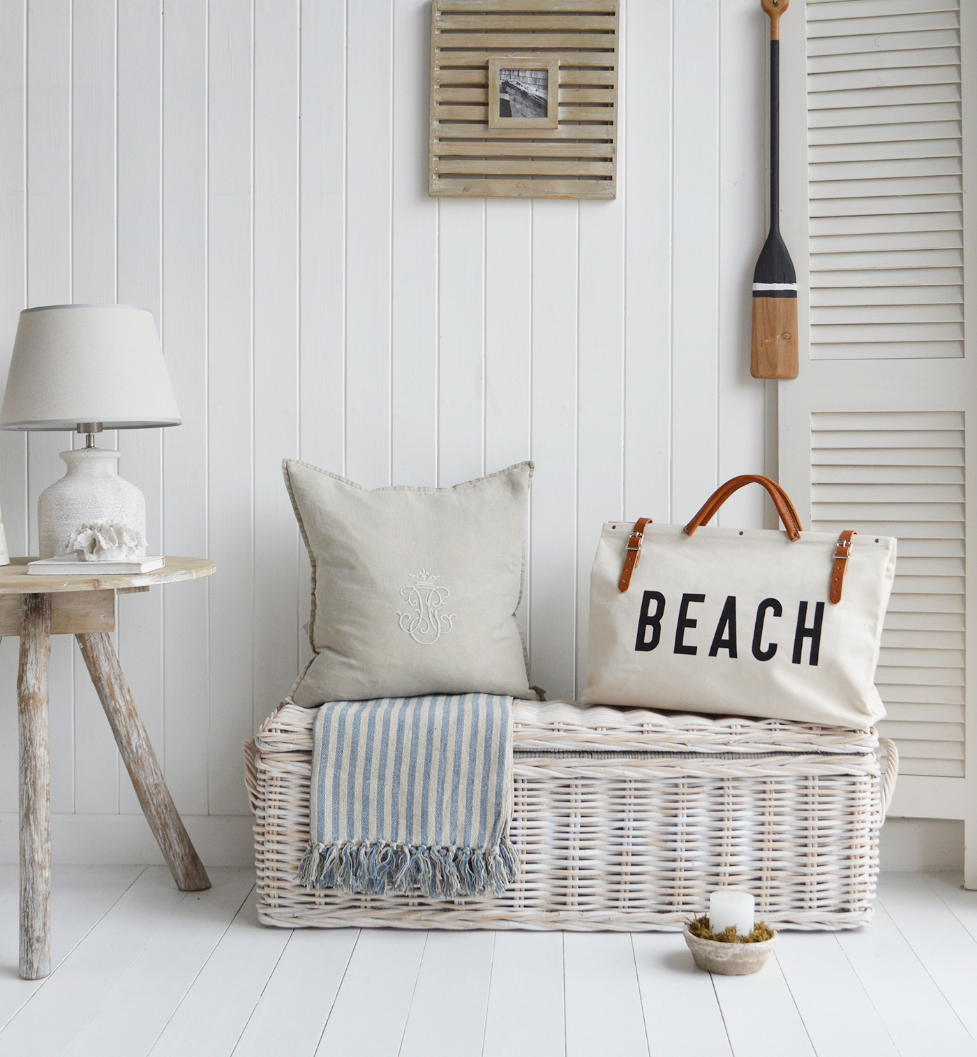 A coastal styled hallway accessorised with the Beach Utility bag and paddle oar, furniture pieces include the Farmington white storage bench and driftwood table, boat beautiful pieces of coastal furniture