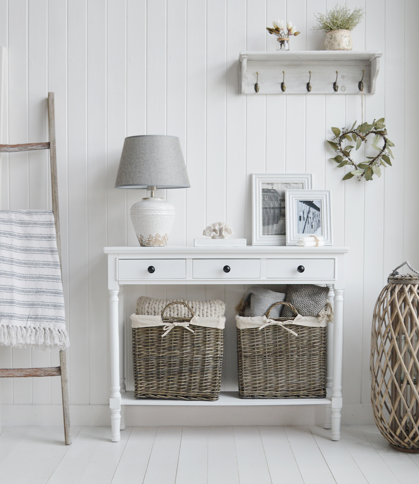 The Georgetown white console hallway table with three drawers, shown here with black handles