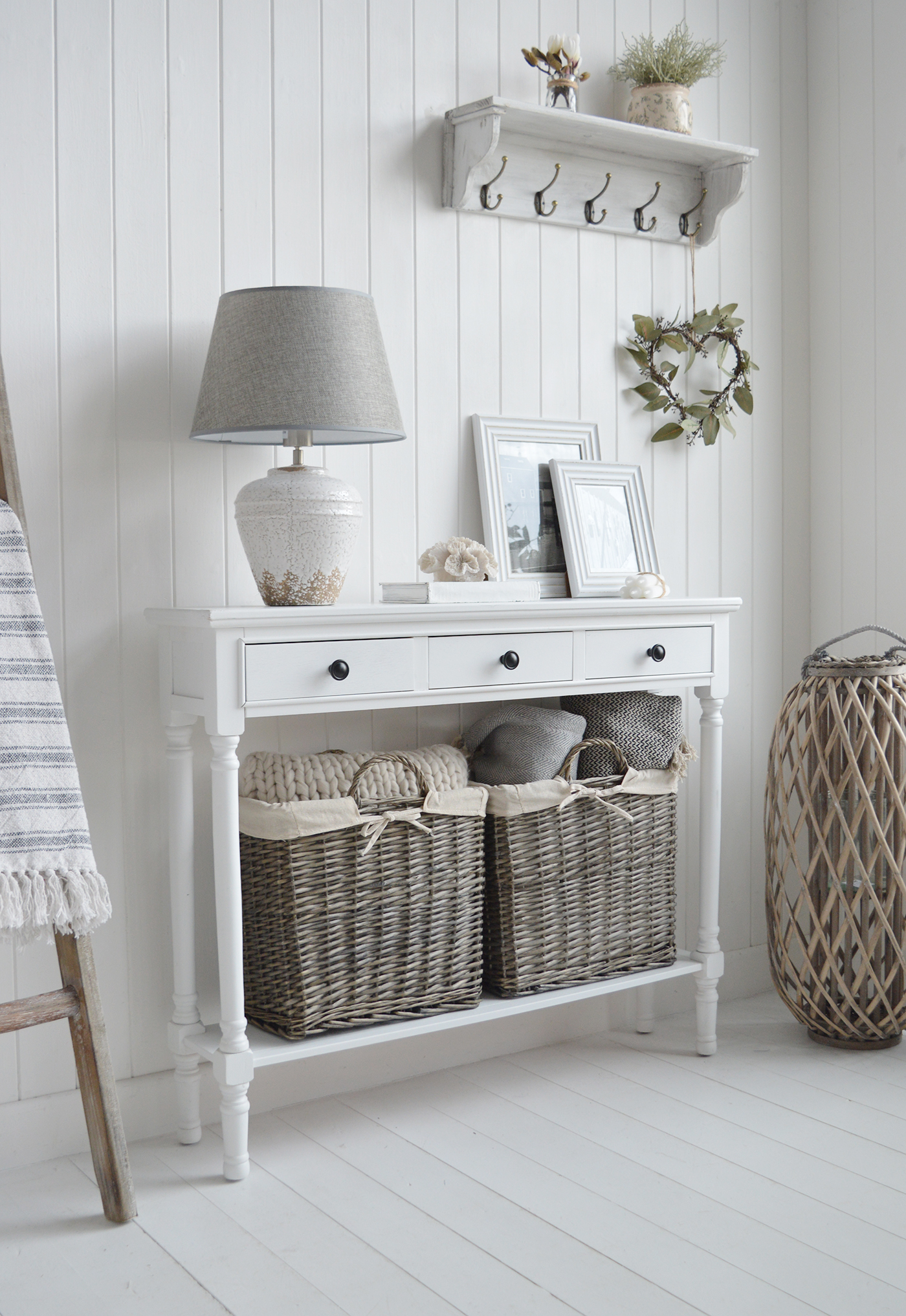 In a neutral hallway, the Georgetown console is complemented with natural baskets to provide functionality and texture making it a perfect piece for a modern country home