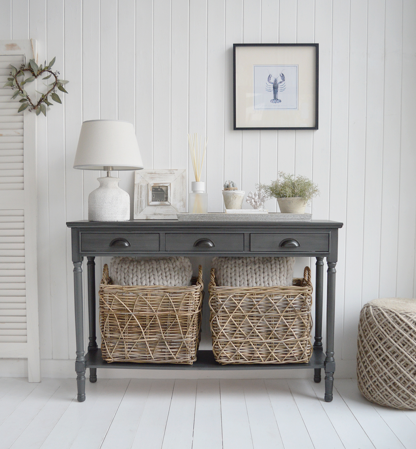 The Greyhaven Console Table in Weathered Slate adds a gentle depth that anchors light, coastal interiors with a refined New England feel..