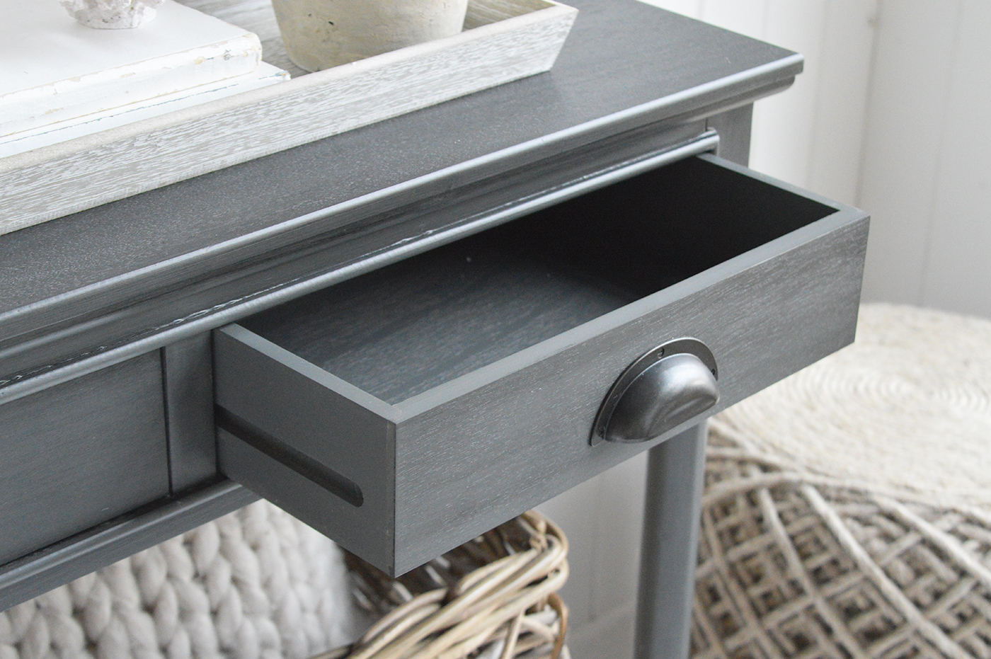 The spacious lower shelf offers practical styling space while maintaining the clean, relaxed aesthetic of modern coastal décor.