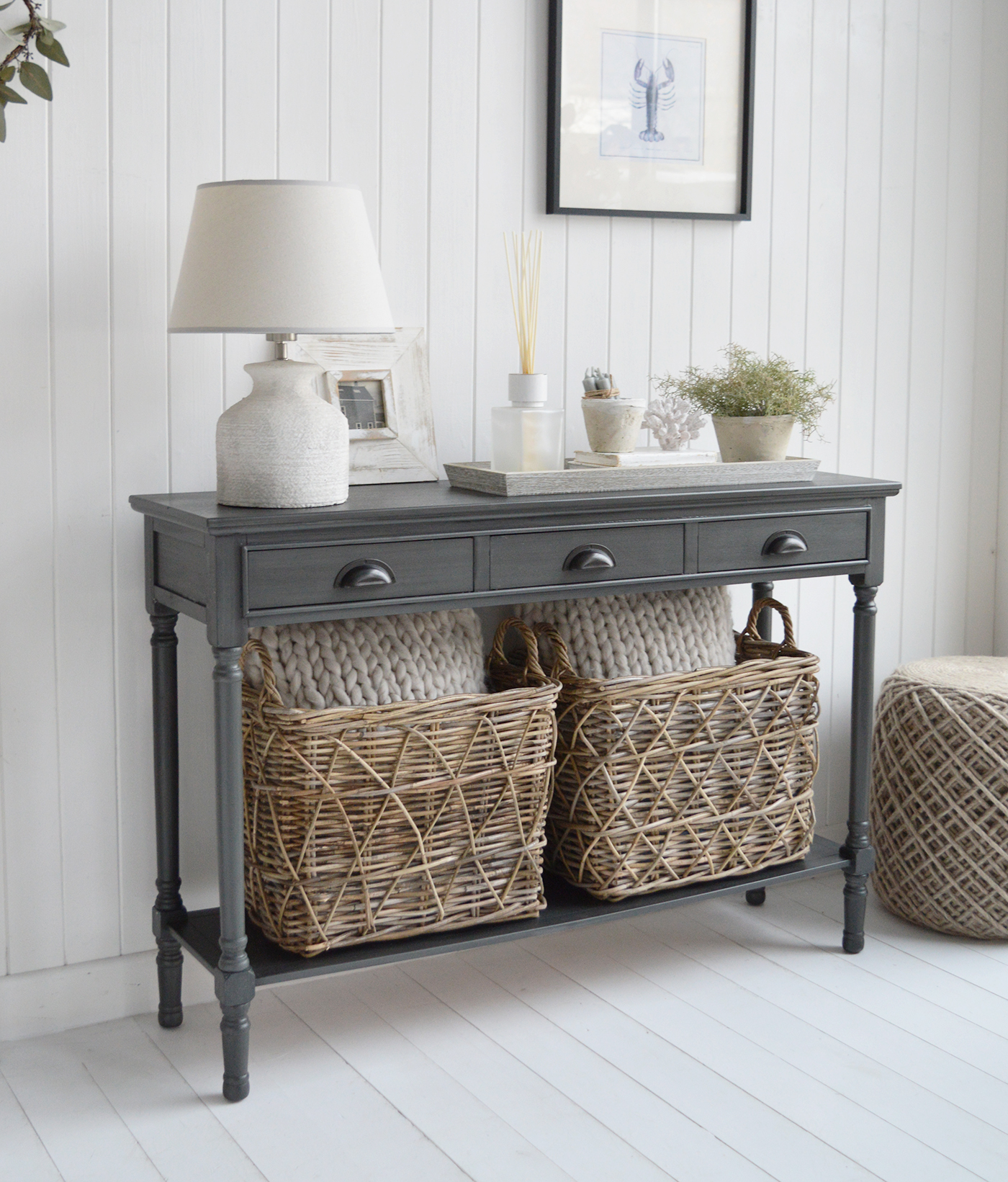 Its softly weathered charcoal finish pairs beautifully with white panelling, natural textures and the layered neutrals typical of coastal homes.