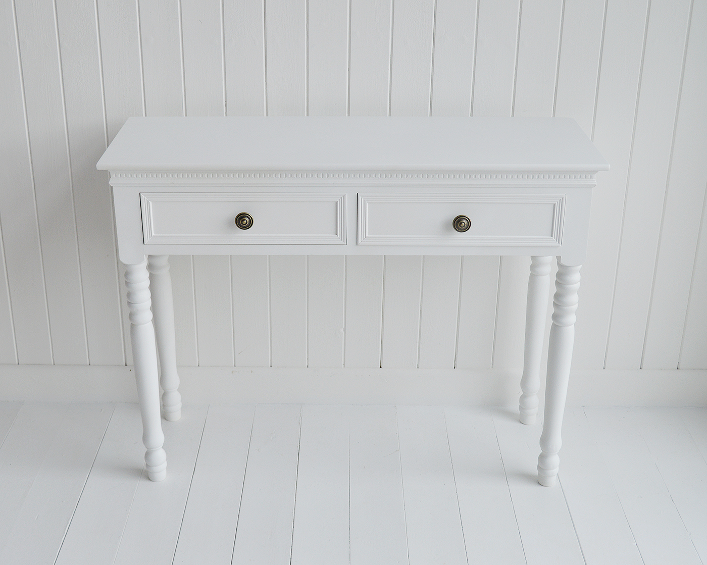 The New England white dressing table with 2 drawers and antique brass handles from The White Lighthouse range of bedroom dressers and furniture. Coastal, country, cottage and city bedroom interiors and decor