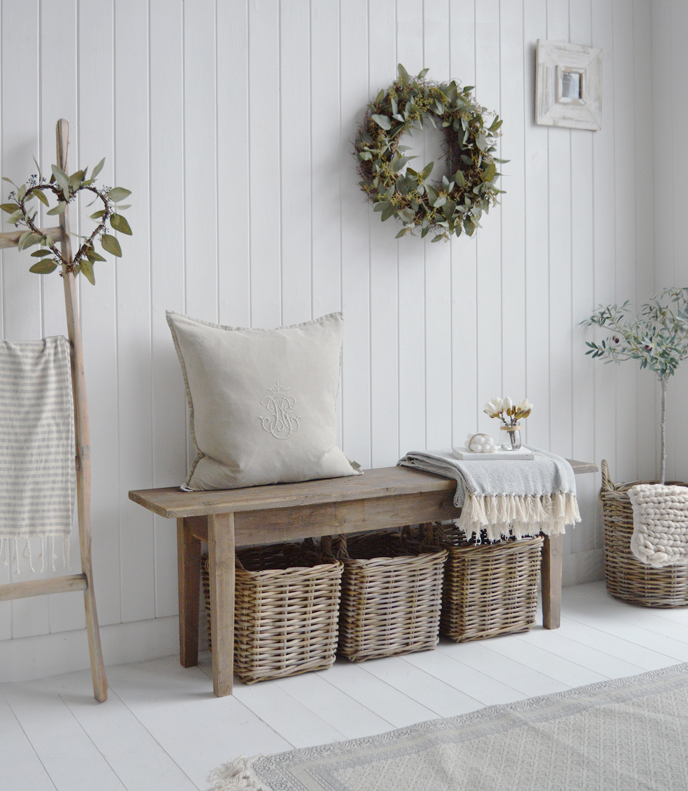 A rustic bench in reclaimed wood for styling and decorating country home interiors