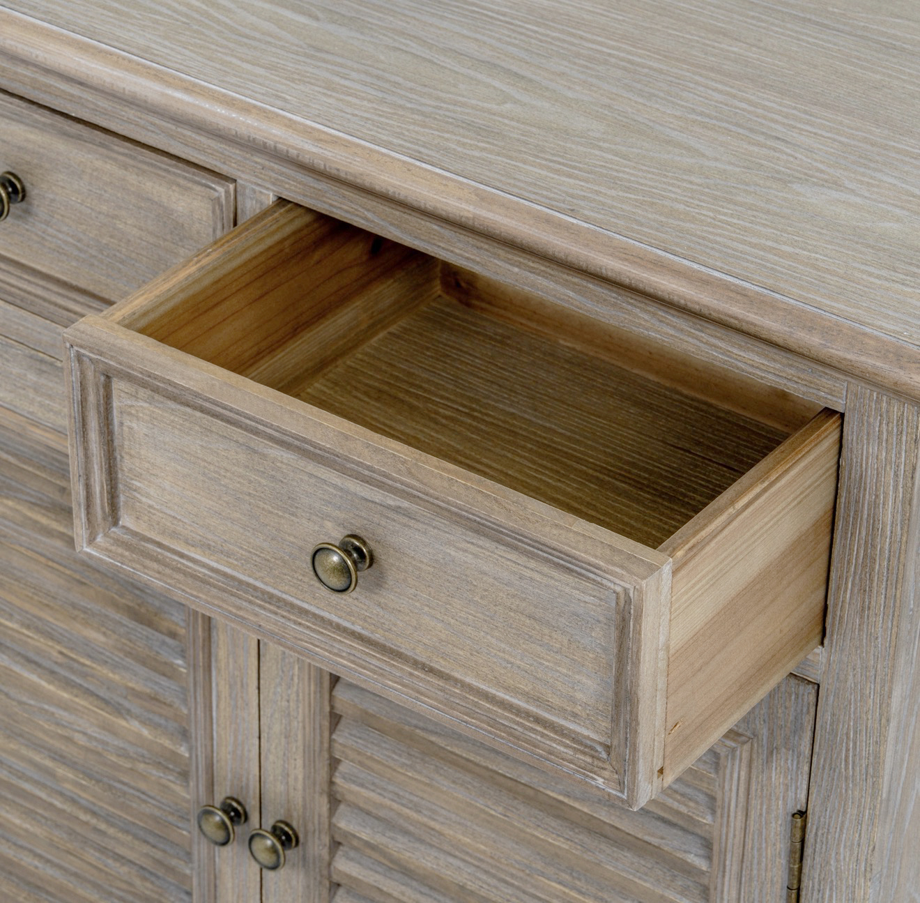 The classic louvred doors and beautifully distressed wood finish make the Portsmouth Cabinet a standout piece for creating a relaxed Hamptons or New England-inspired interior.