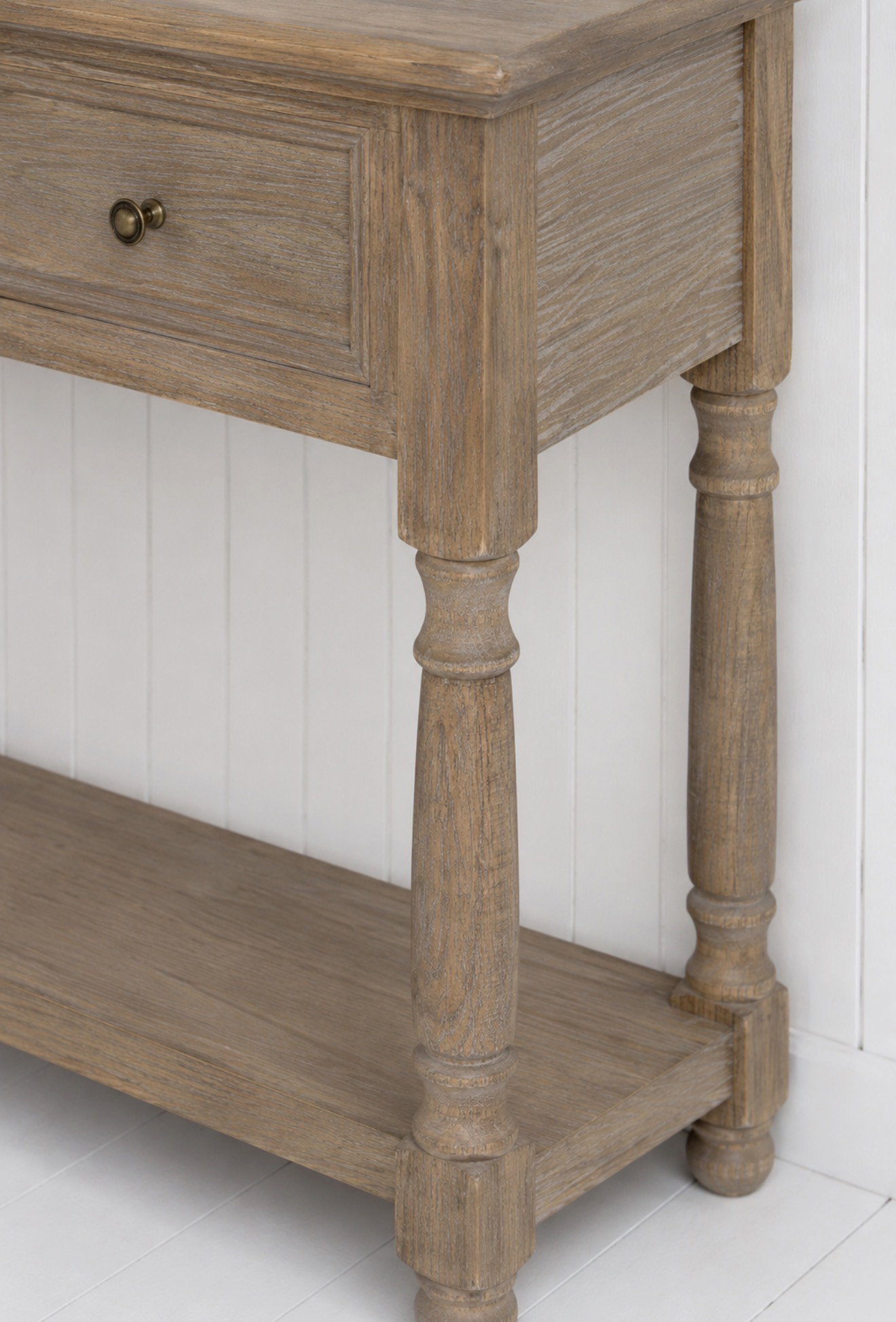 Complete your modern coastal home with the Portsmouth Console Table, designed to combine beautiful craftsmanship with everyday functionality.