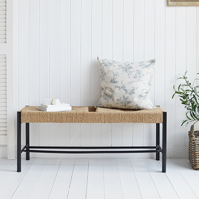 The black Wakefield bench furniture in a white room in coastal and modern farmhouse style interiors to create a striking and contemporary aesthetic
