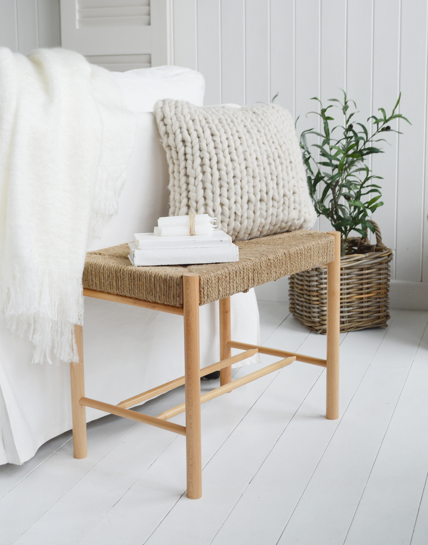 The Wakefield woven bench, can be used as a decorative accent in a room. Placing it against a wall or under a window can create a cozy reading nook or a visually appealing vignette. The woven texture can complement different decor styles, such as beach house, coastal, or rustic modern farmhouse