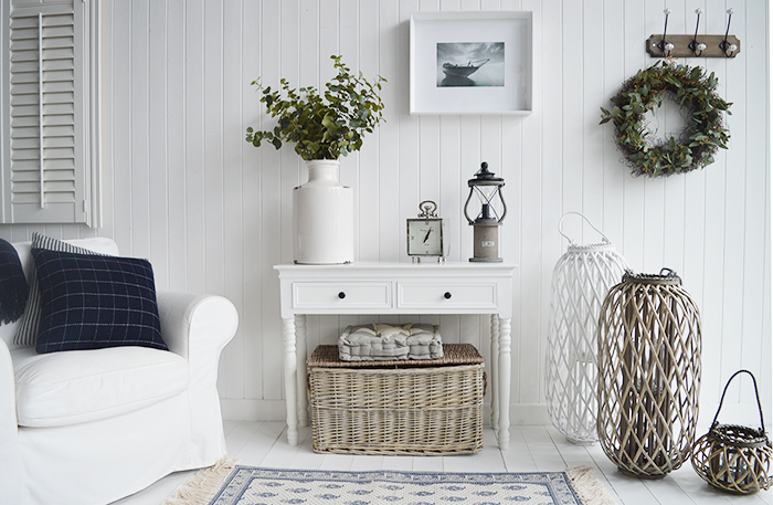 White Living room furniture with New Englan white console and tall white and grey lanterns