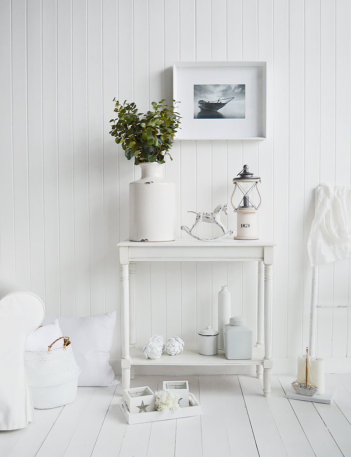 White home decor and furniture from The White Lighthouse. A colonial white console table with a shelf for hallway and living room furniture in New England, coastal, country and city homes