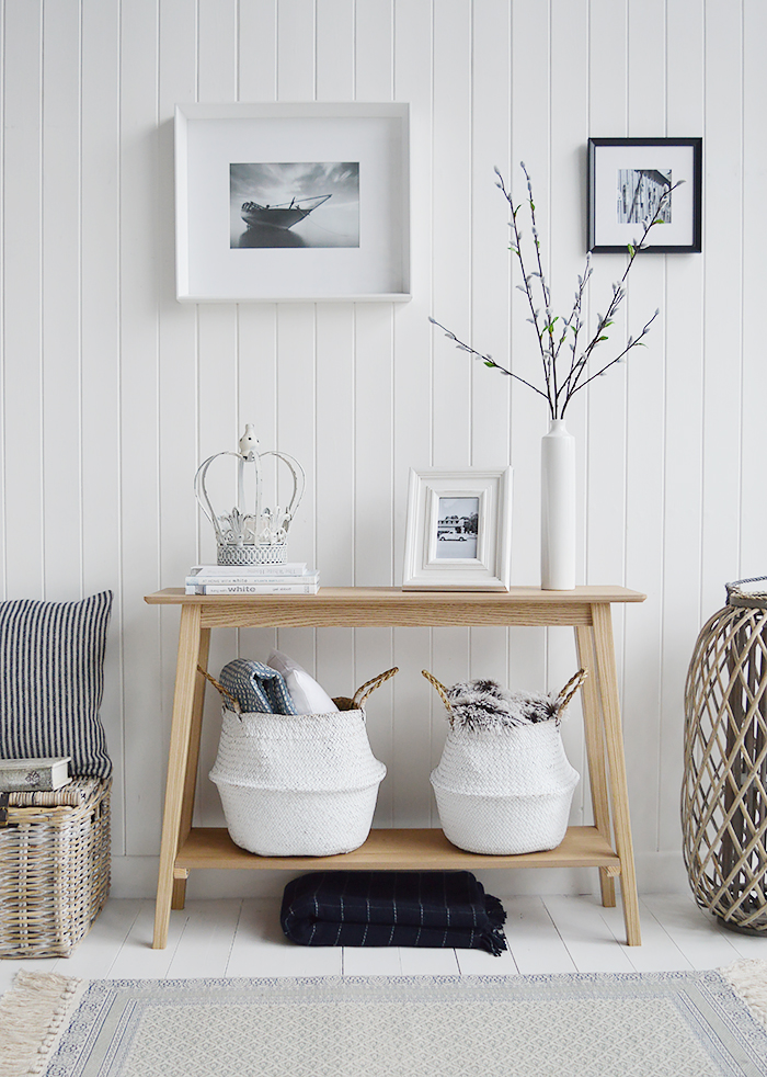 Specifically designed for narrow hallways our New Shoreham hall table is a perfect choice at only 30cm deep at the widest top. In a light coloured wood veneer the table will impeccably complement all home interiors and styles. A traditional  simple design with the straight lines giving it a modern touch.The shelf adds to the look of the table as well as offering an area for display or storage…