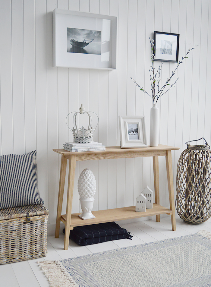 Specifically designed for narrow hallways our New Shoreham hall table is a perfect choice at only 30cm deep at the widest top. In a light coloured wood veneer the table will impeccably complement all home interiors and styles. A traditional  simple design with the straight lines giving it a modern touch.The shelf adds to the look of the table as well as offering an area for display or storage…