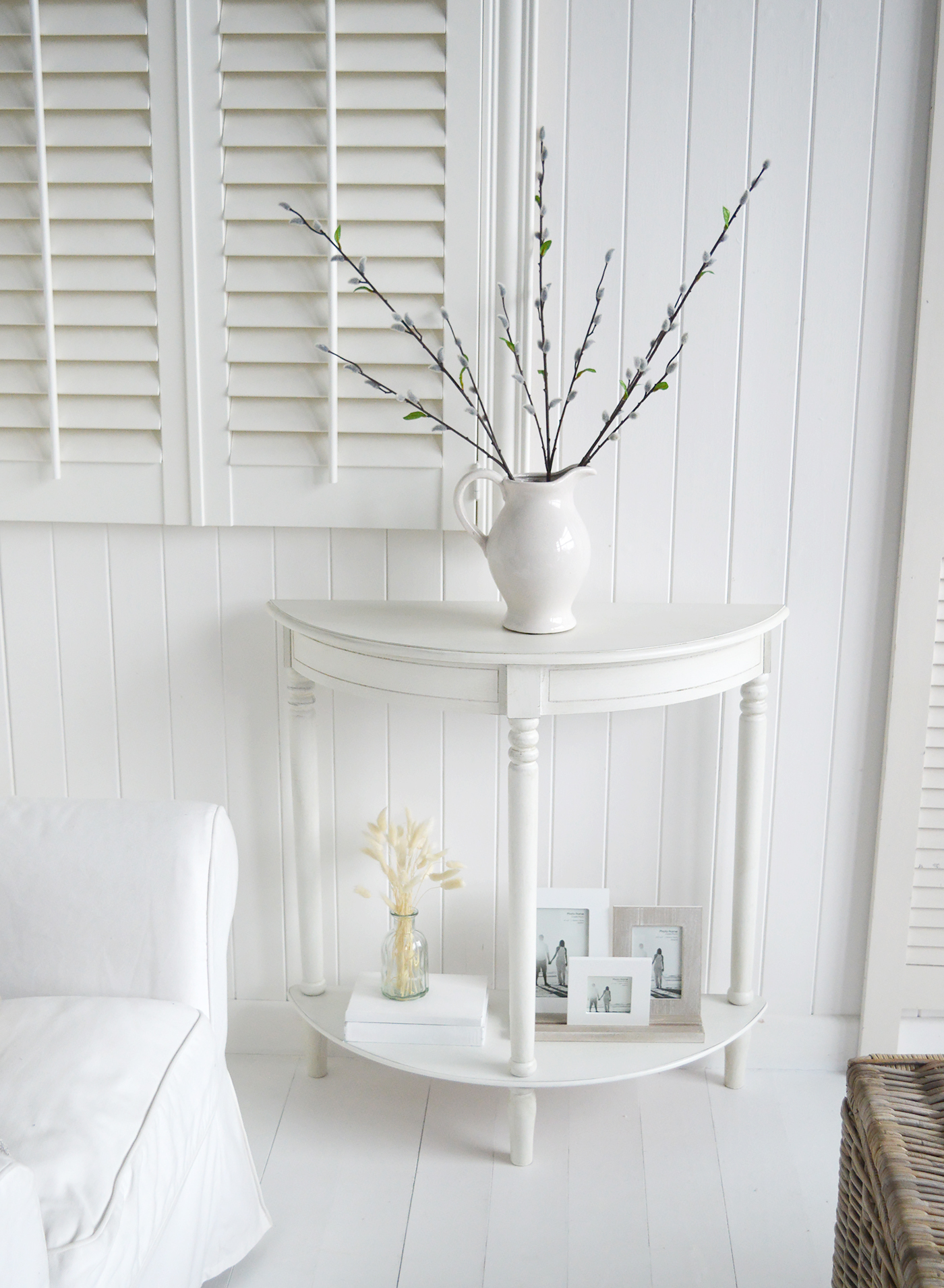 The White Lighthouse Cape Ann furniture in white. A half moon console table with shelf. Hallway furniture and hall table. Ideal for hall or living room