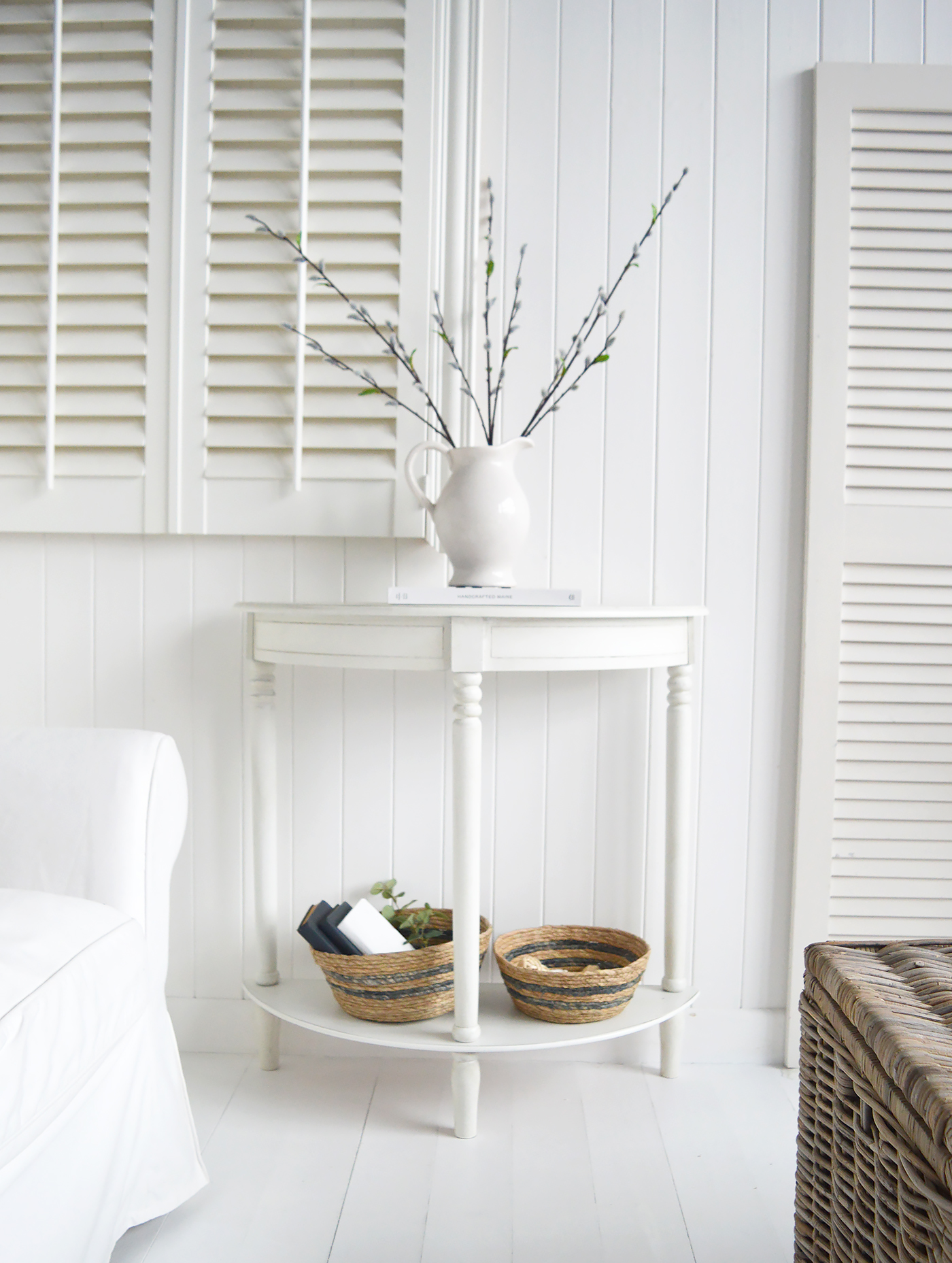 The White Lighthouse Cape Ann furniture in white. A half moon console table with shelf. Hallway furniture and hall table. Ideal for hall or living room