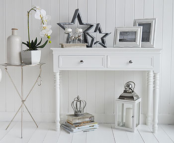 White hall table with silver handles and accessories for the hallway to match