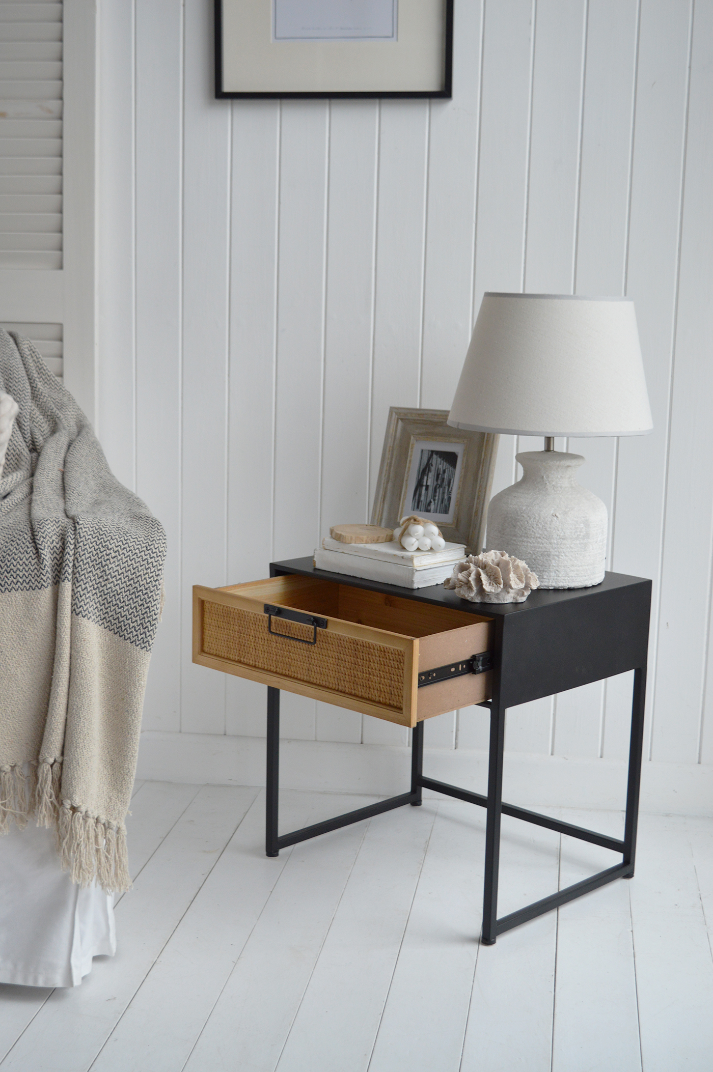 With its spacious drawer, the rattan nightstand offers both practical storage and a stylish focal point.