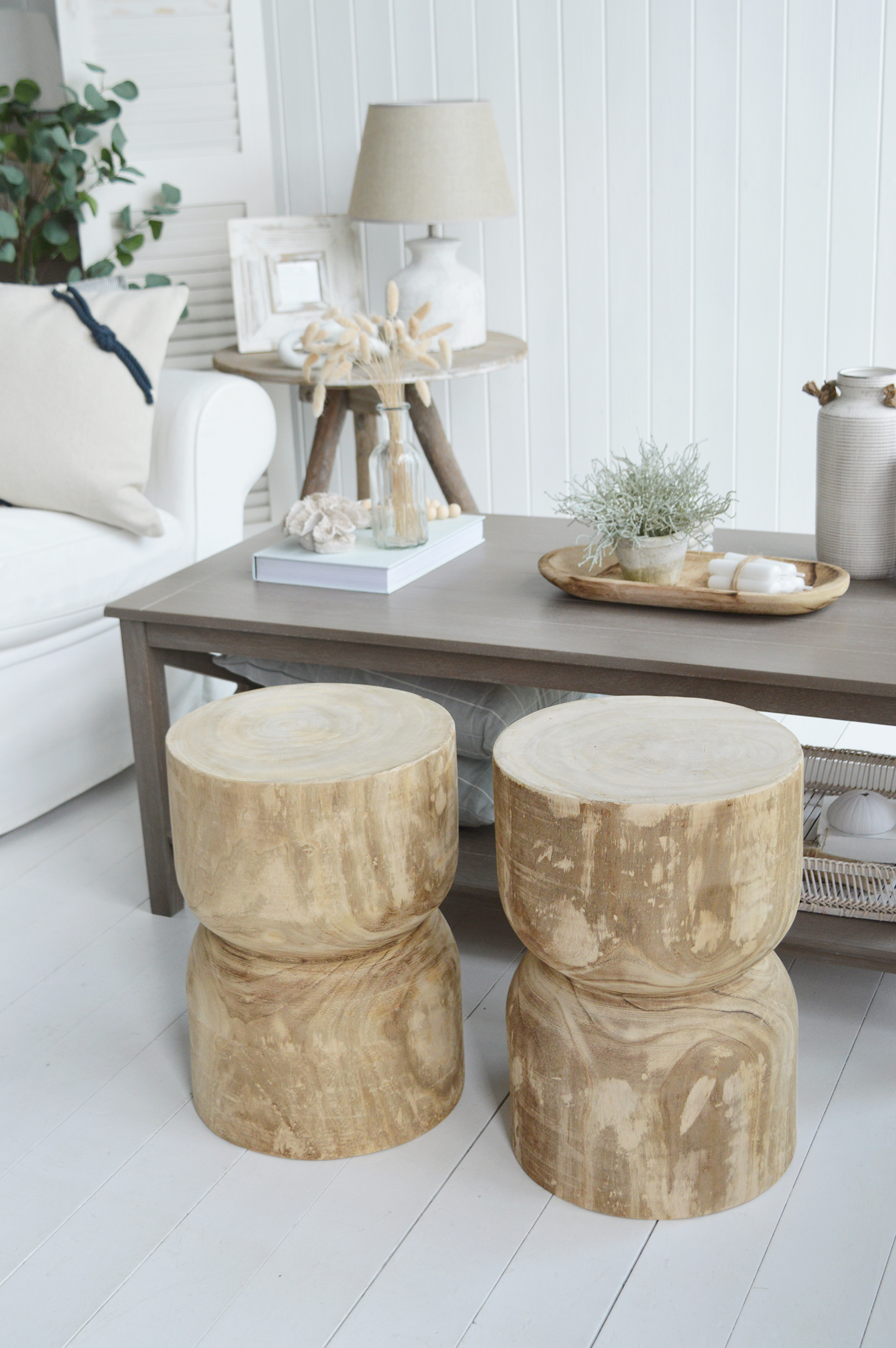 The Ascot wooden stools around a coastal coffee table for a chic Hamptons look to a living room