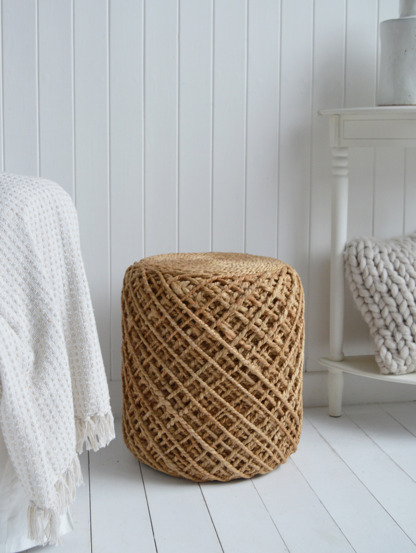 The hand-woven design creates beautiful texture and depth, ideal for layering in coastal-inspired spaces.