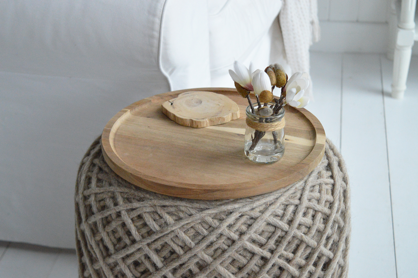 The Bayport Weave Stool brings natural texture and coastal charm to any room, finished with a wooden tray that turns it effortlessly into a practical side table.