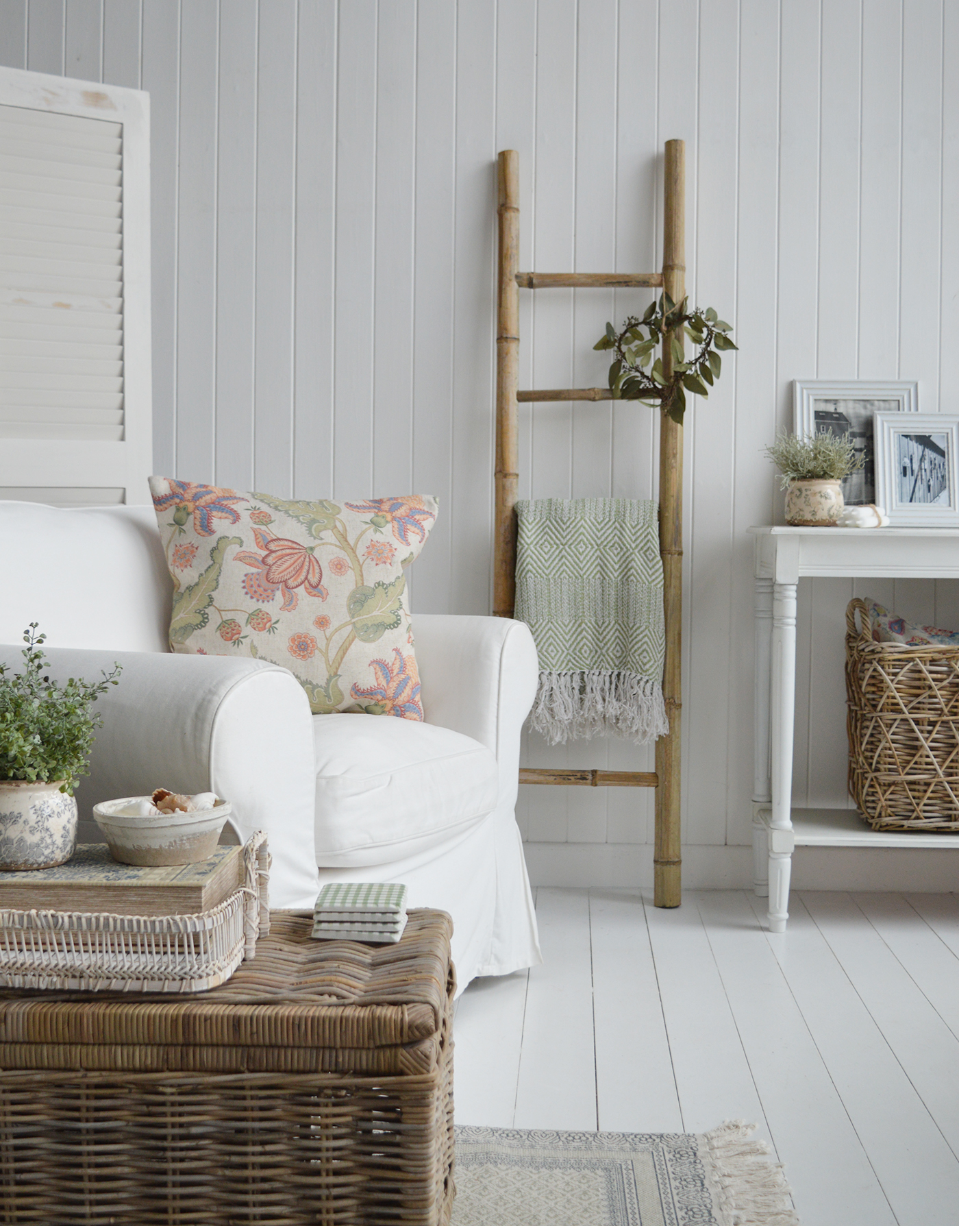 The Hudson Bamboo blanket ladder, showun here with cushions, pillows and throws in shades of green, suitanle for the interiors and to complement the furniture of modern farmhouse, coastal and country homes