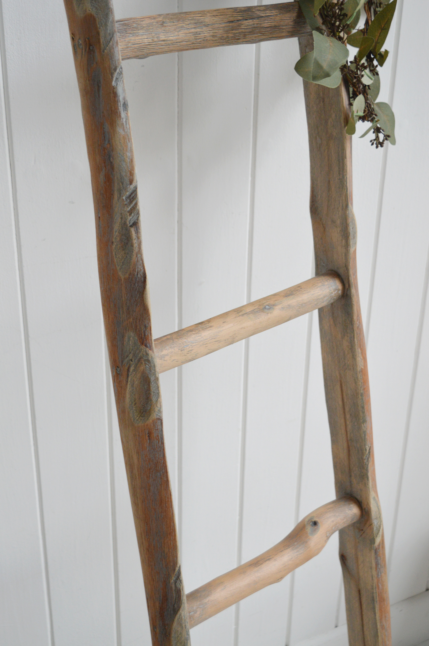 Driftwood wooden blanket ladder in a Hamptons living room 