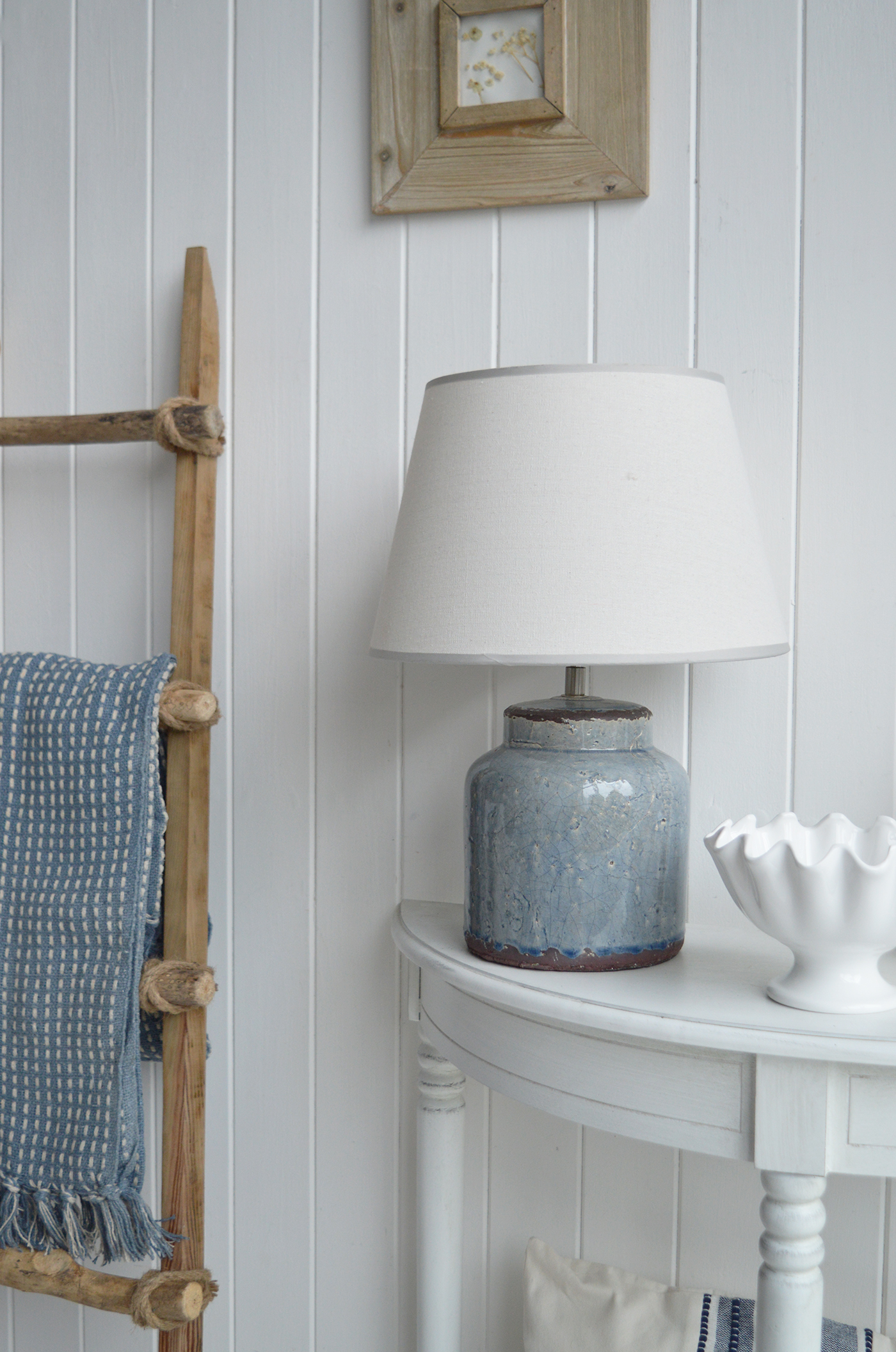 Layered shades of blue bring depth and character to a light coastal interior.