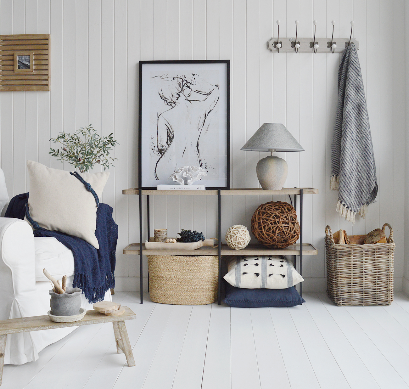 The Bridgeport sideboard, simply designed with two shelves, is perfect for styling your cherished pieces.

In a grey washed wood effect finish, the elegant curved shelves offer a textural contrast against the clean lines of the black metal frame.

Ideal as a sofa table to separate areas in an open plan room or as a console to style as a centre piece in your hallway or living area