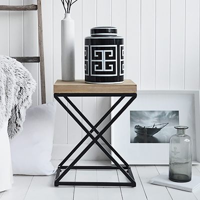 New England lamp table. A black and white palette is timeless. Mixed with natural materials, cushions and throws with plently of texture and interest gives a classic New England look to your interior.