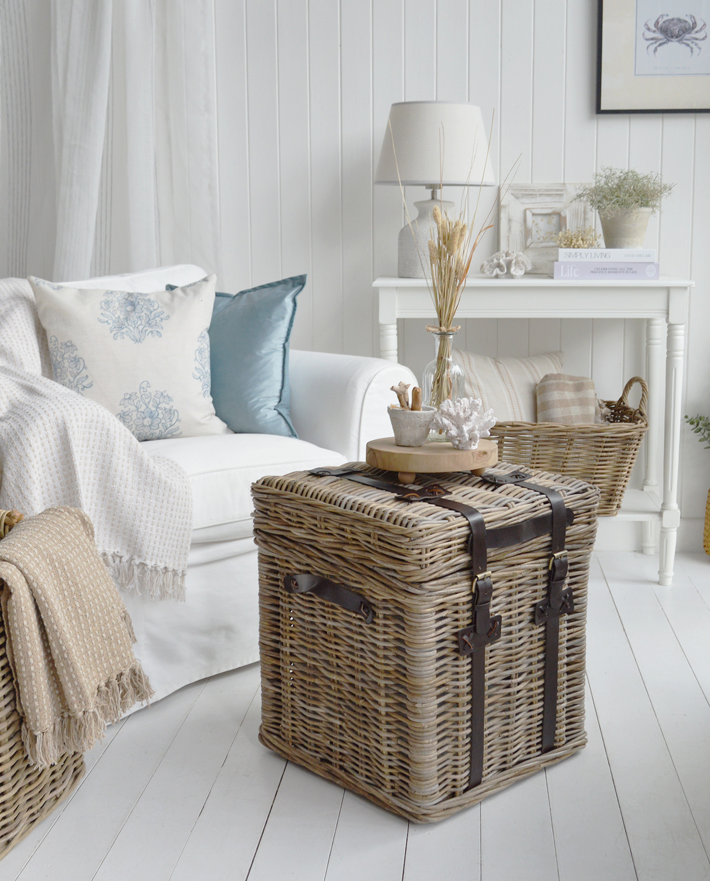 This timeless coastal living room blends pale blue accents, sandy shades and natural materials to create a beautifully balanced space.