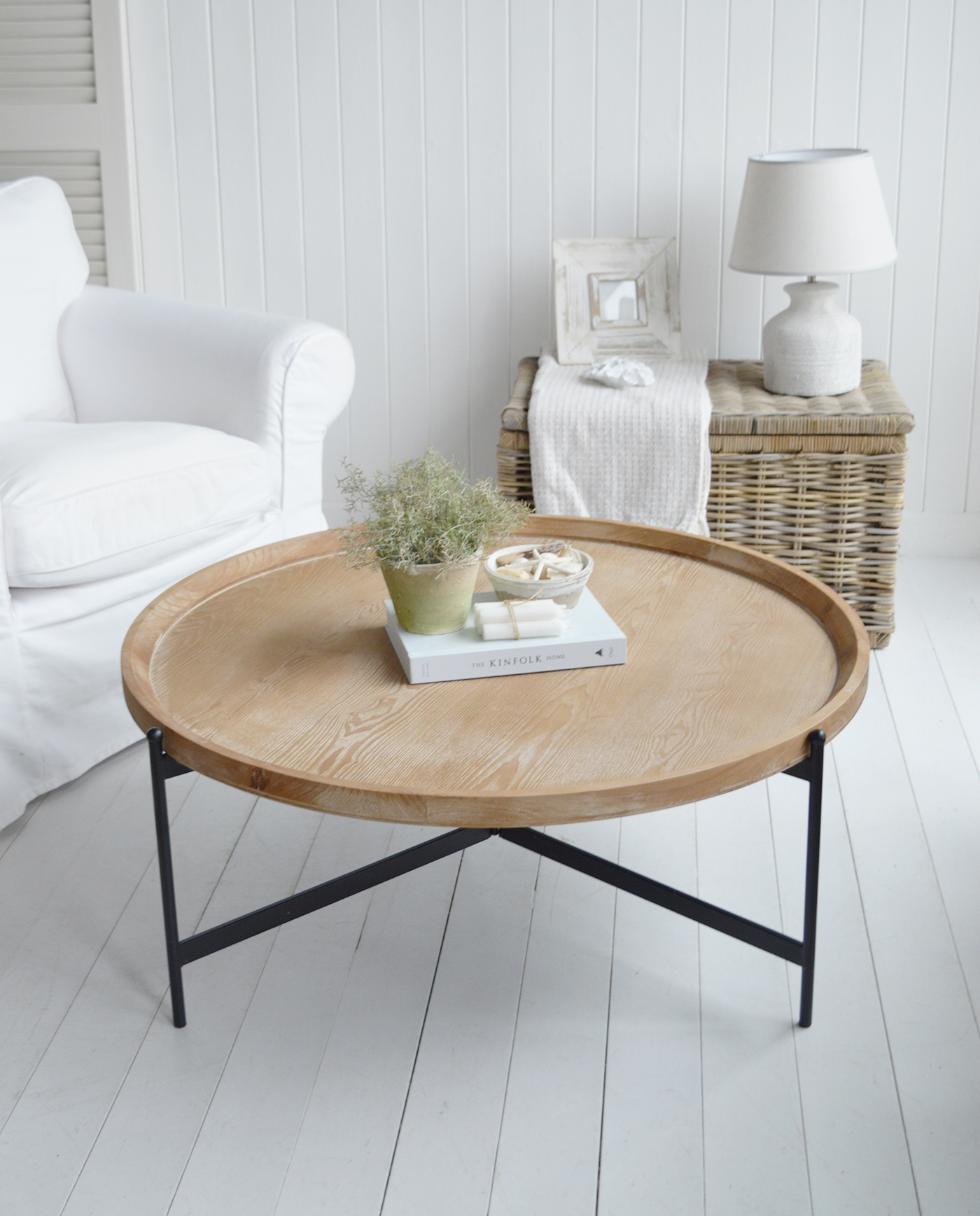 Inspired by coastal and colonial interiors, this elegant Salisbury coffee table combines a soft whitewashed finish with bold black legs, creating the perfect blend of rustic warmth and timeless sophistication.