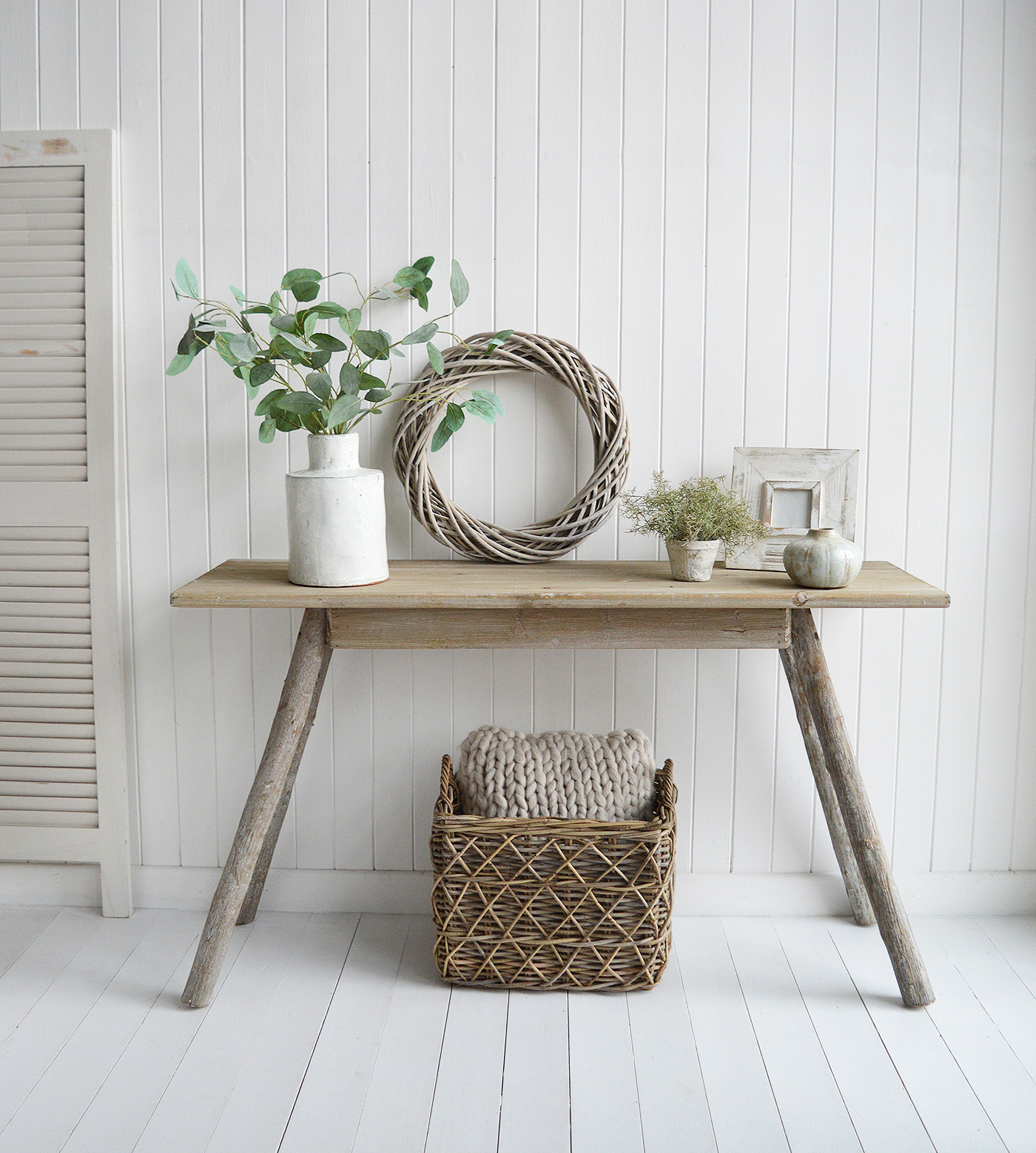 Inspired by the raw beauty of nature, this driftwood effect console table exudes refined elegance with its soft, weathered finish and coastal style.