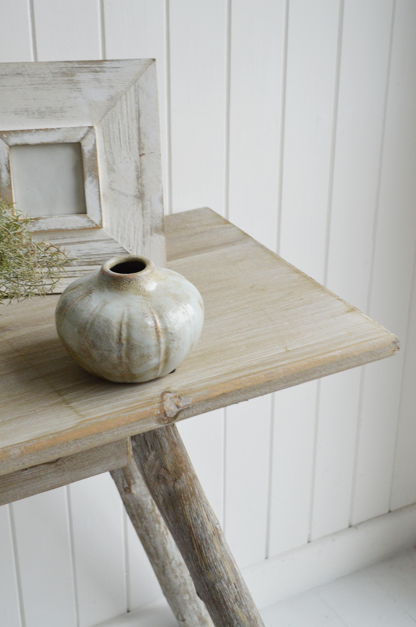 With its subtly distressed finish and organic wood grain detailing, this Driftwood console table adds depth, texture, and sophistication to any coastal entryway or living space.