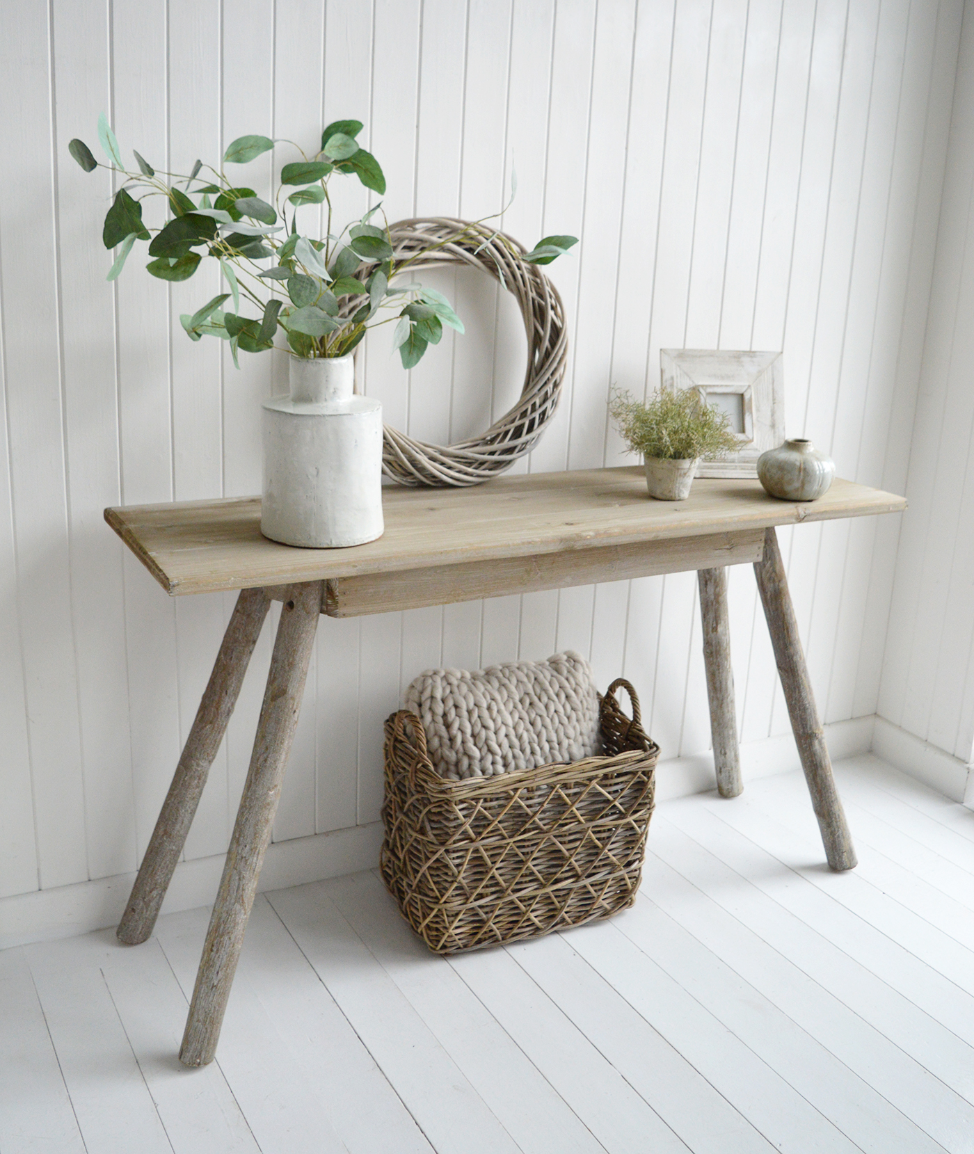 Blending rustic charm with contemporary sophistication, this console table features a luxurious driftwood-inspired texture, perfect for an effortlessly stylish home.
