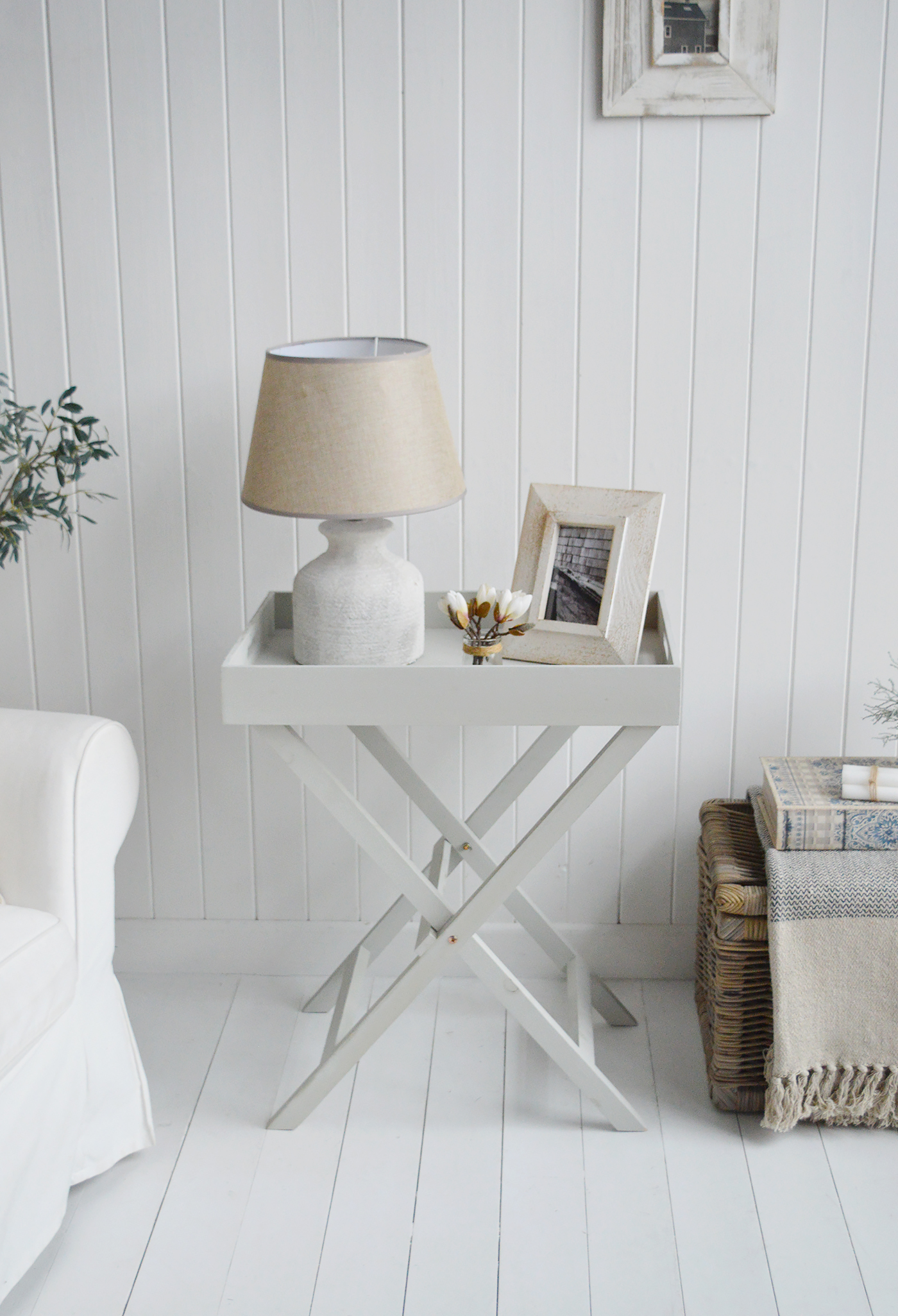 Elegant New England Coastal and Country Furniture. Finished in an aged grey paint with distressing, the Fairfax table is a butler tray table with three insert trays that can be used throughout the home for display