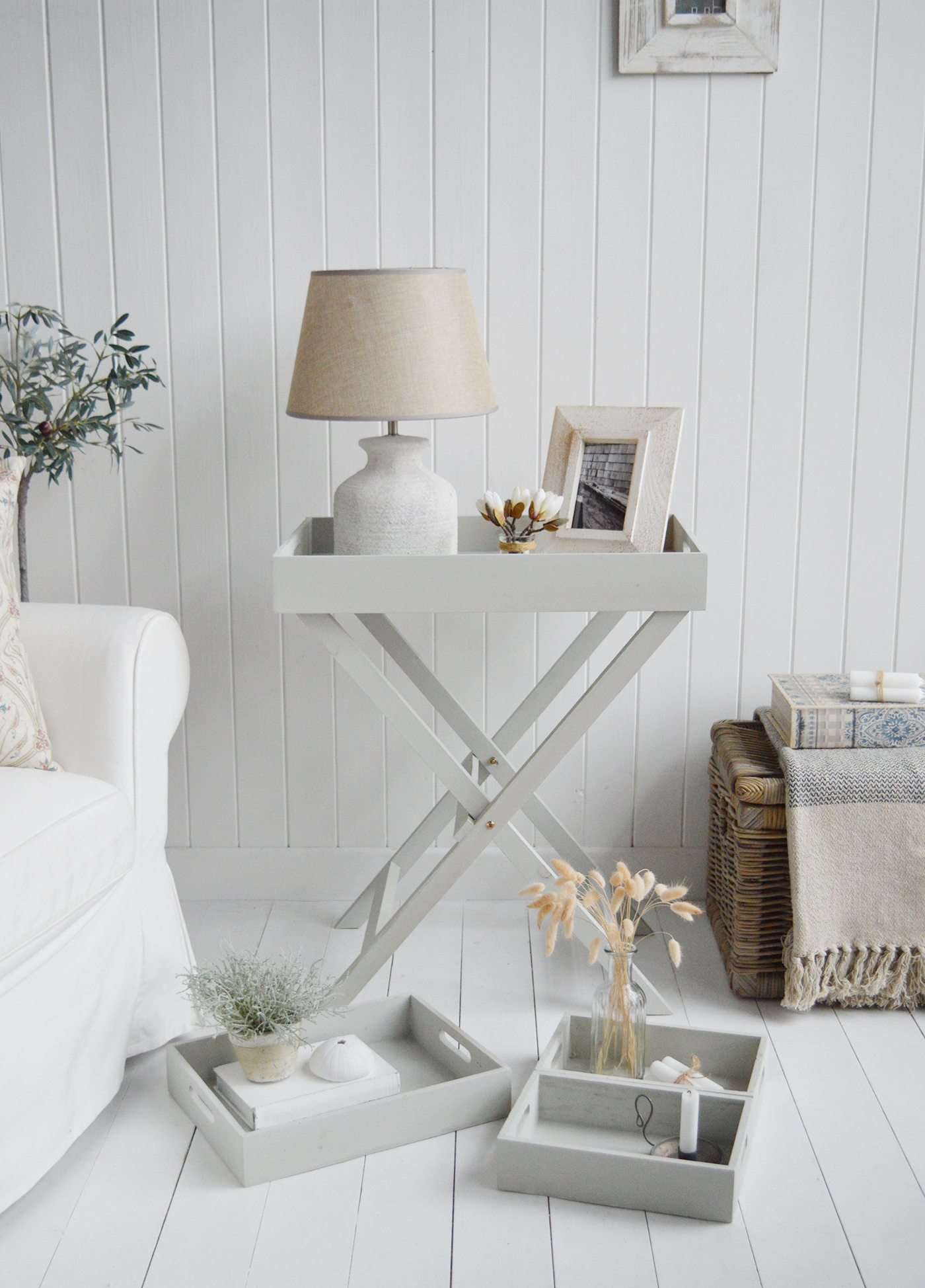 Elegant New England Coastal and Country Furniture. Finished in an aged grey paint with distressing, the Fairfax table is a butler tray table with three insert trays that can be used throughout the home for display