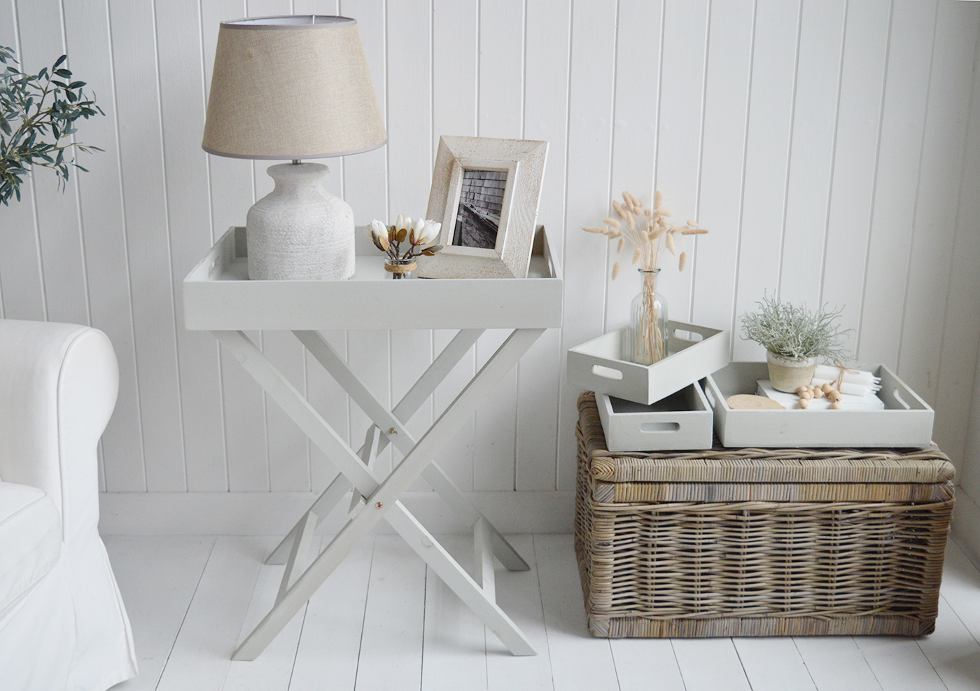 Elegant New England Coastal and Country Furniture. Finished in an aged grey paint with distressing, the Fairfax table is a butler tray table with three insert trays that can be used throughout the home for display