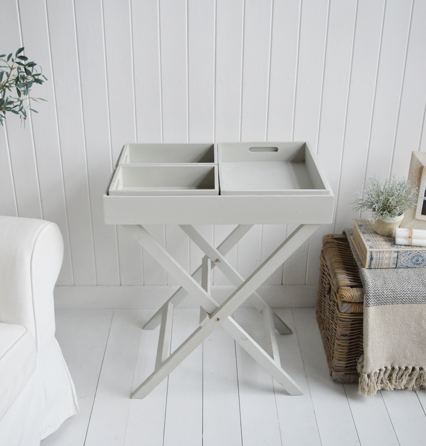 Elegant New England Coastal and Country Furniture. Finished in an aged grey paint with distressing, the Fairfax table is a butler tray table with three insert trays that can be used throughout the home for display