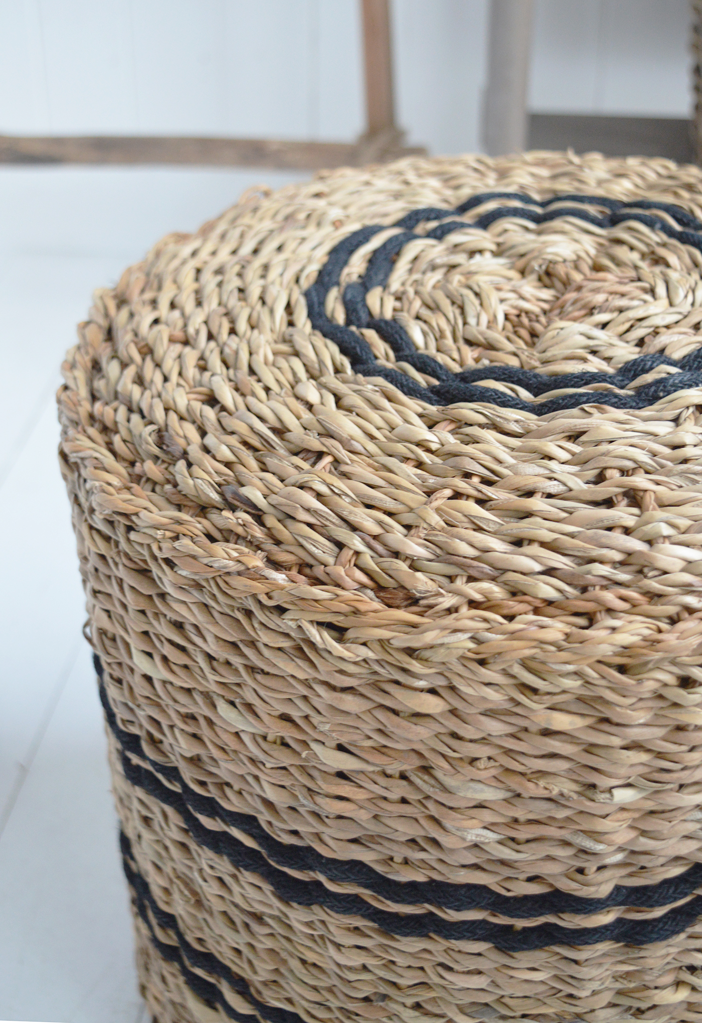 Its woven seagrass finish pairs beautifully with white furniture and neutral interiors.