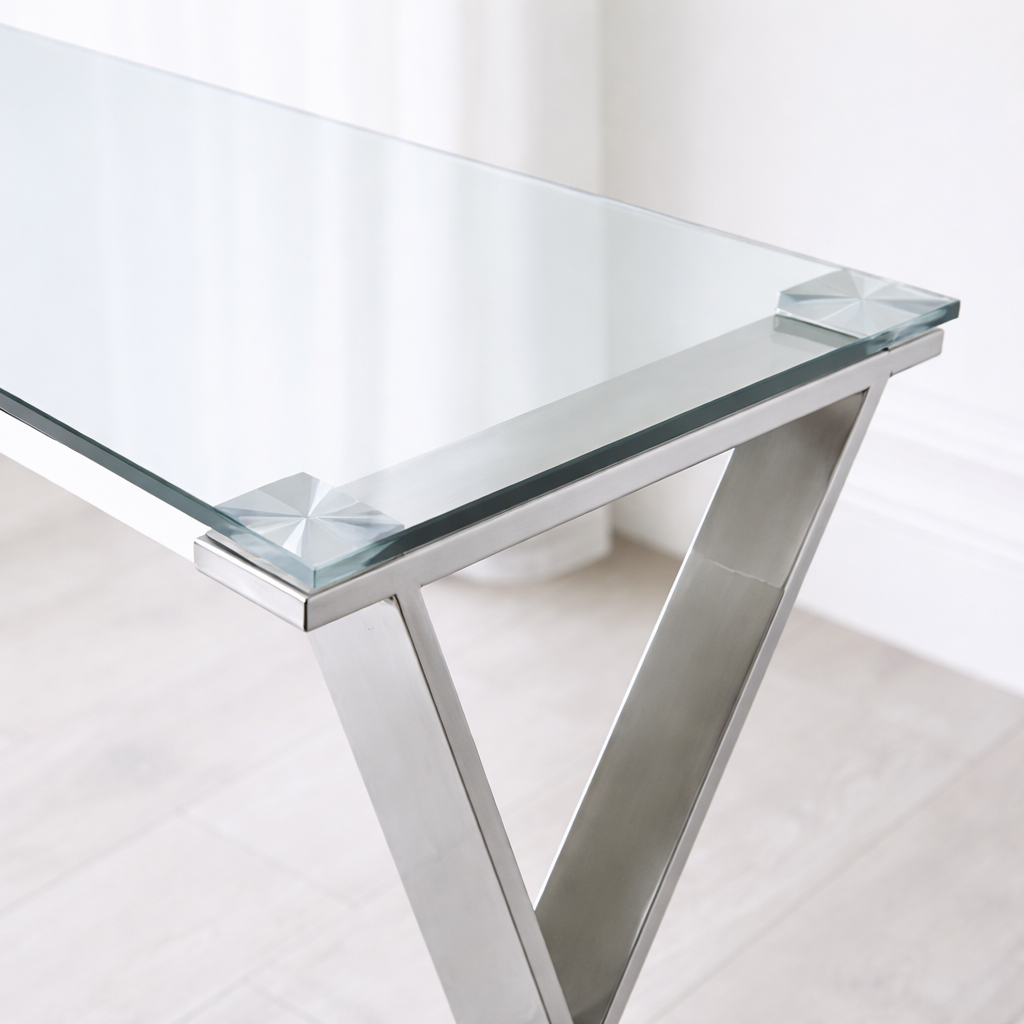 This glass console table brings understated luxury to neutral interiors, pairing clean lines with a polished stainless steel frame.