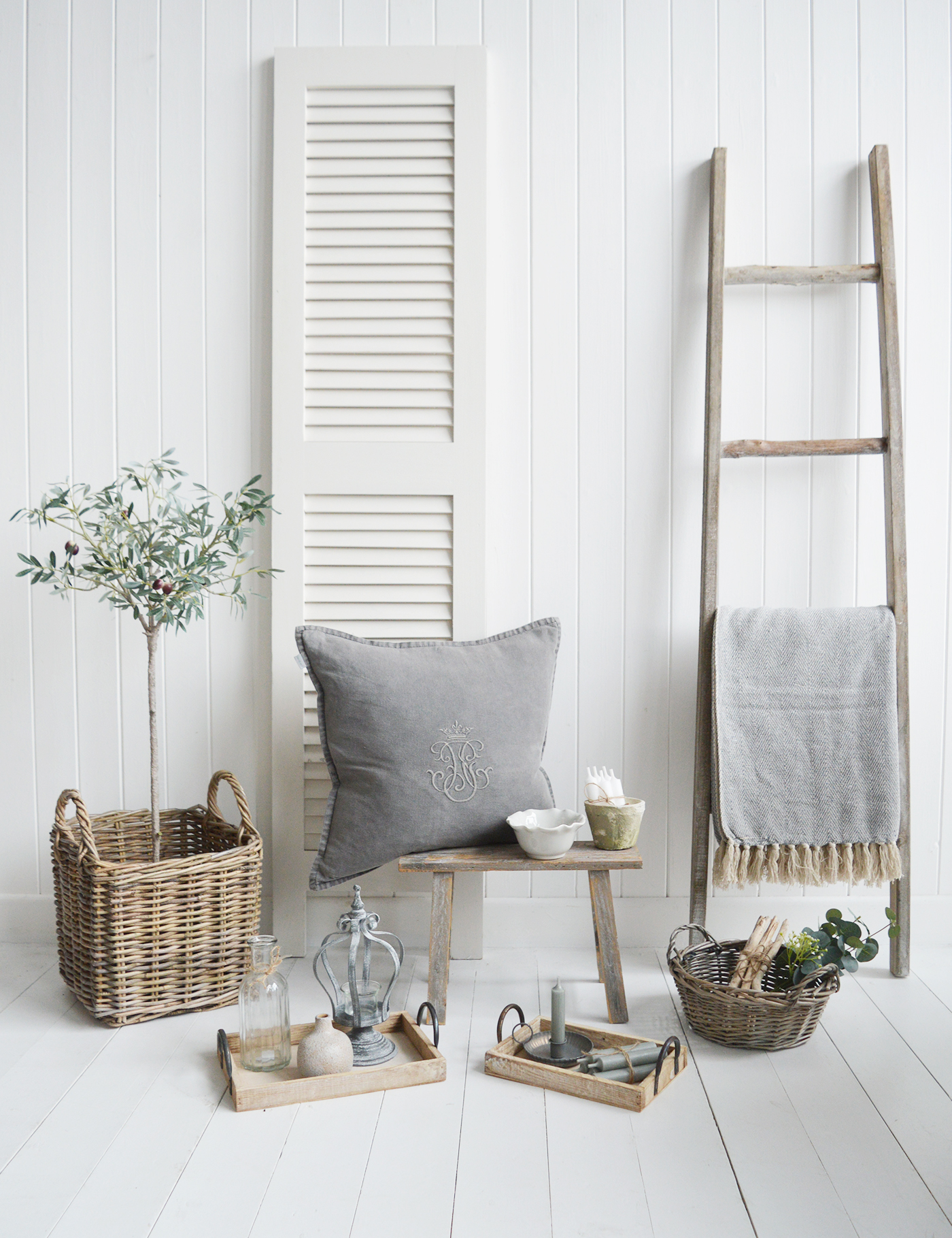 new England home decor and accessories for coastal, country, modern farmhouse and country homes and interiors. Items include wooden driftwood blanket ladder, artificial olive tree, pawtucket tray and rustic decorative stool and baskets