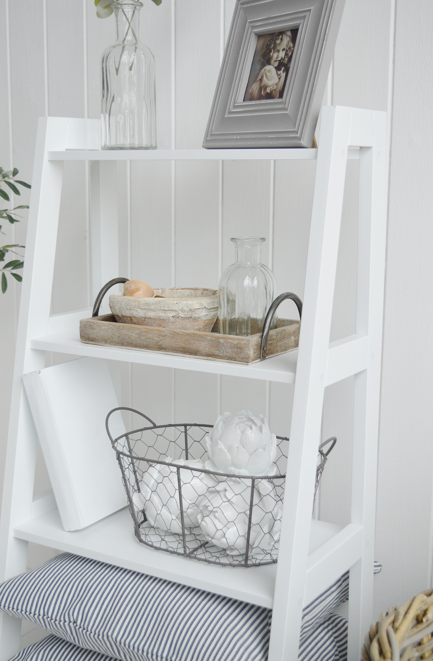 The Patten white shelf unit with four shelves for living room furniture in New England country, coastal and city home interiors