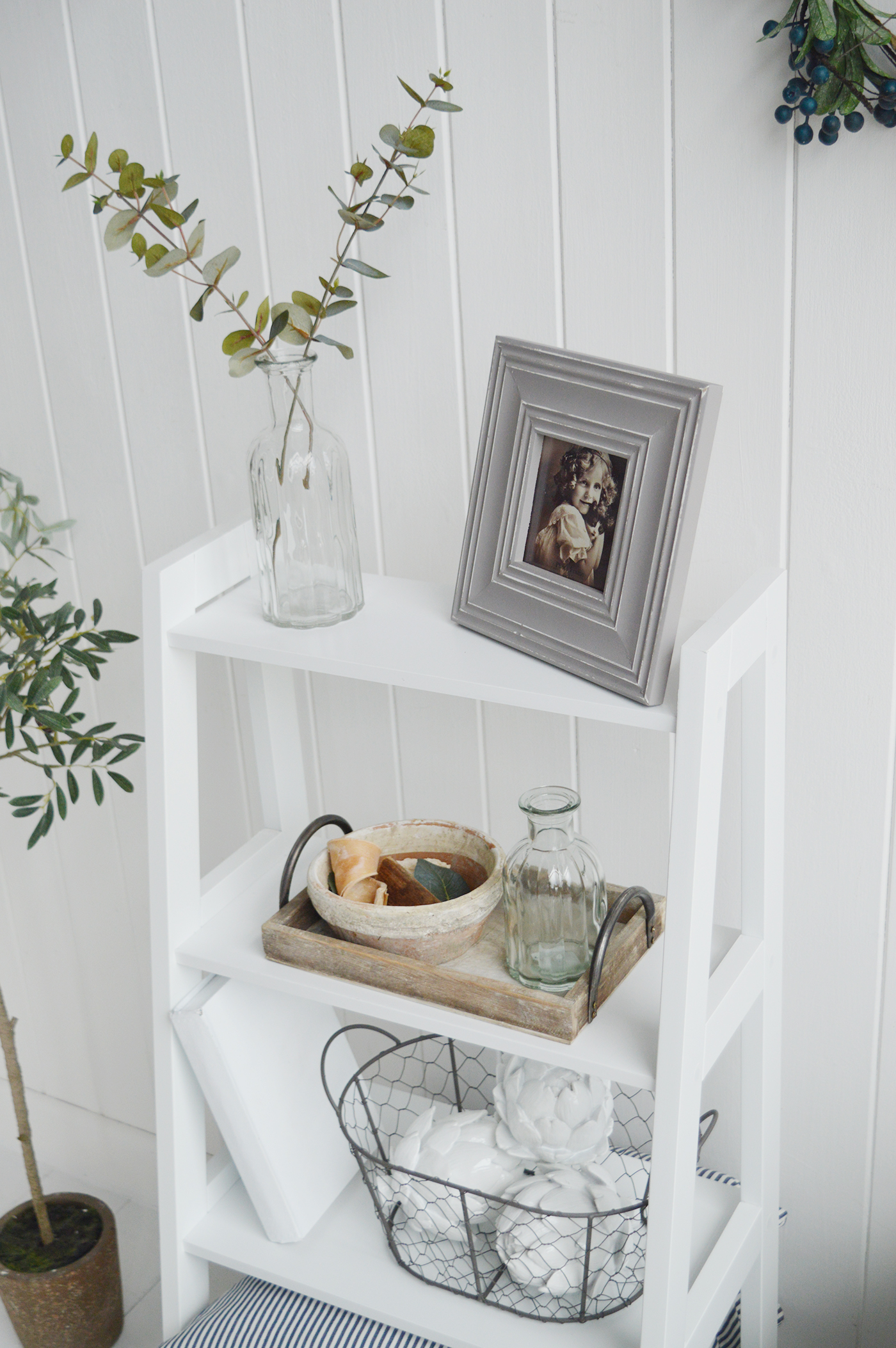 The Patten white shelf unit with four shelves for living room furniture in New England country, coastal and city home interiors