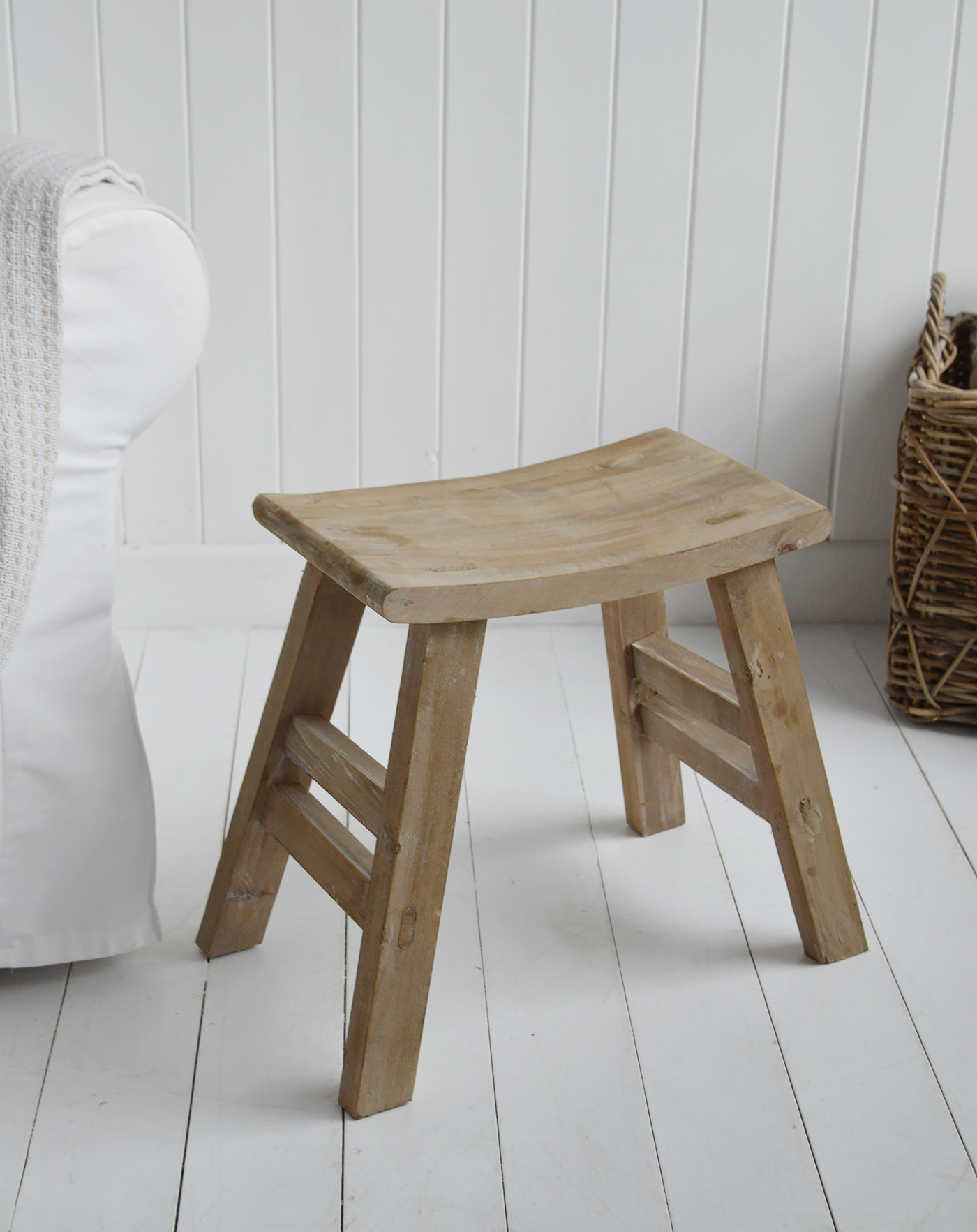 Handcrafted Pawtucket wooden stool table beside white sofa in beach house style interior